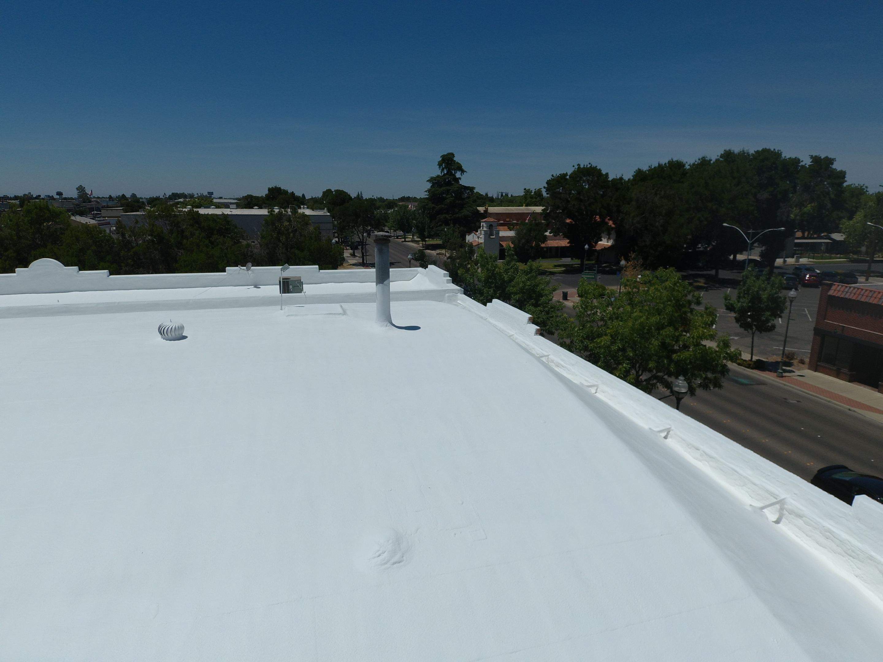 Spray foam and coatings using Conklin Benchmark/PUMA XL coatings and spray foam by Straight Edge Roofing Inc