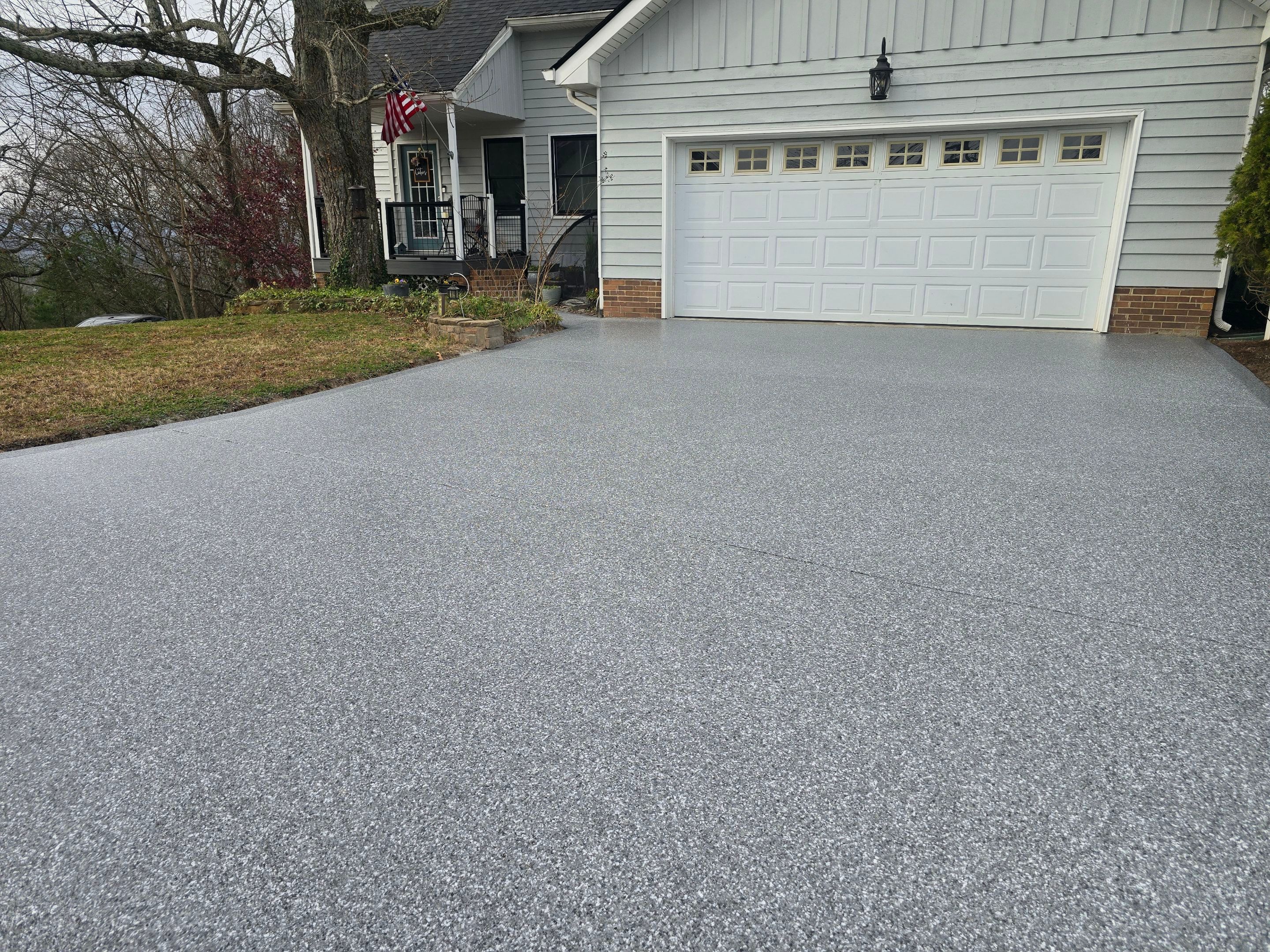 Driveway Using Weathered Gray with the Border in Nightfall by Elite Floor Solutions