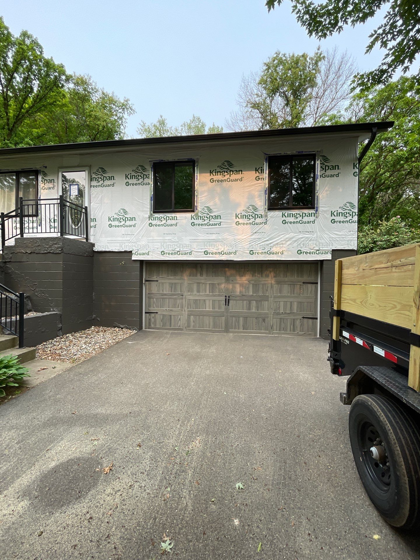 Premium Exterior Remodel – Alside Charter Oak Siding, Hayfield Black Frame Windows, Edco Soffit & Fascia by First Impressions Exteriors