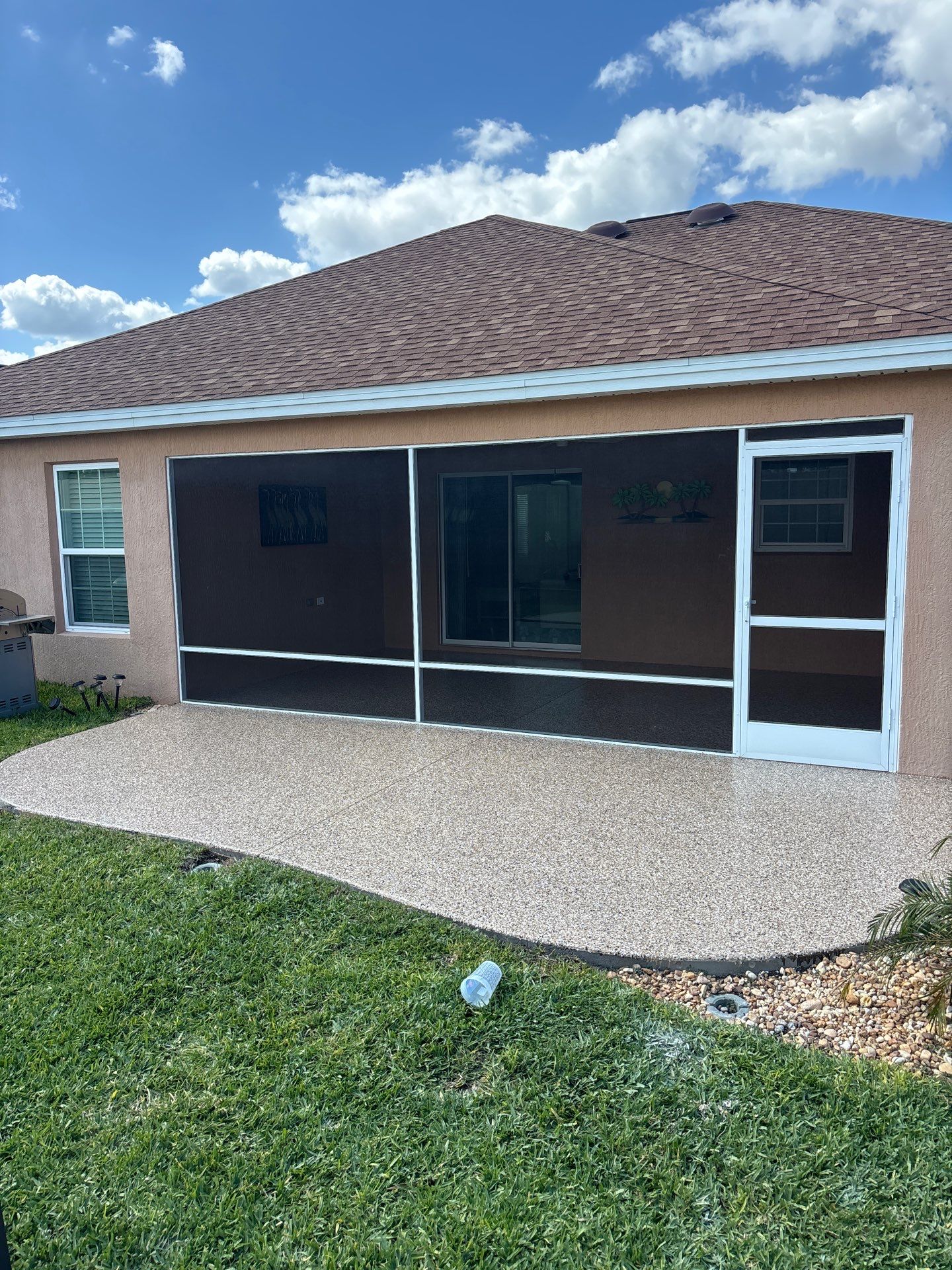 Garage and Lanai With Exterior Pad in Sandstone  by Innovative Concrete Coatings 