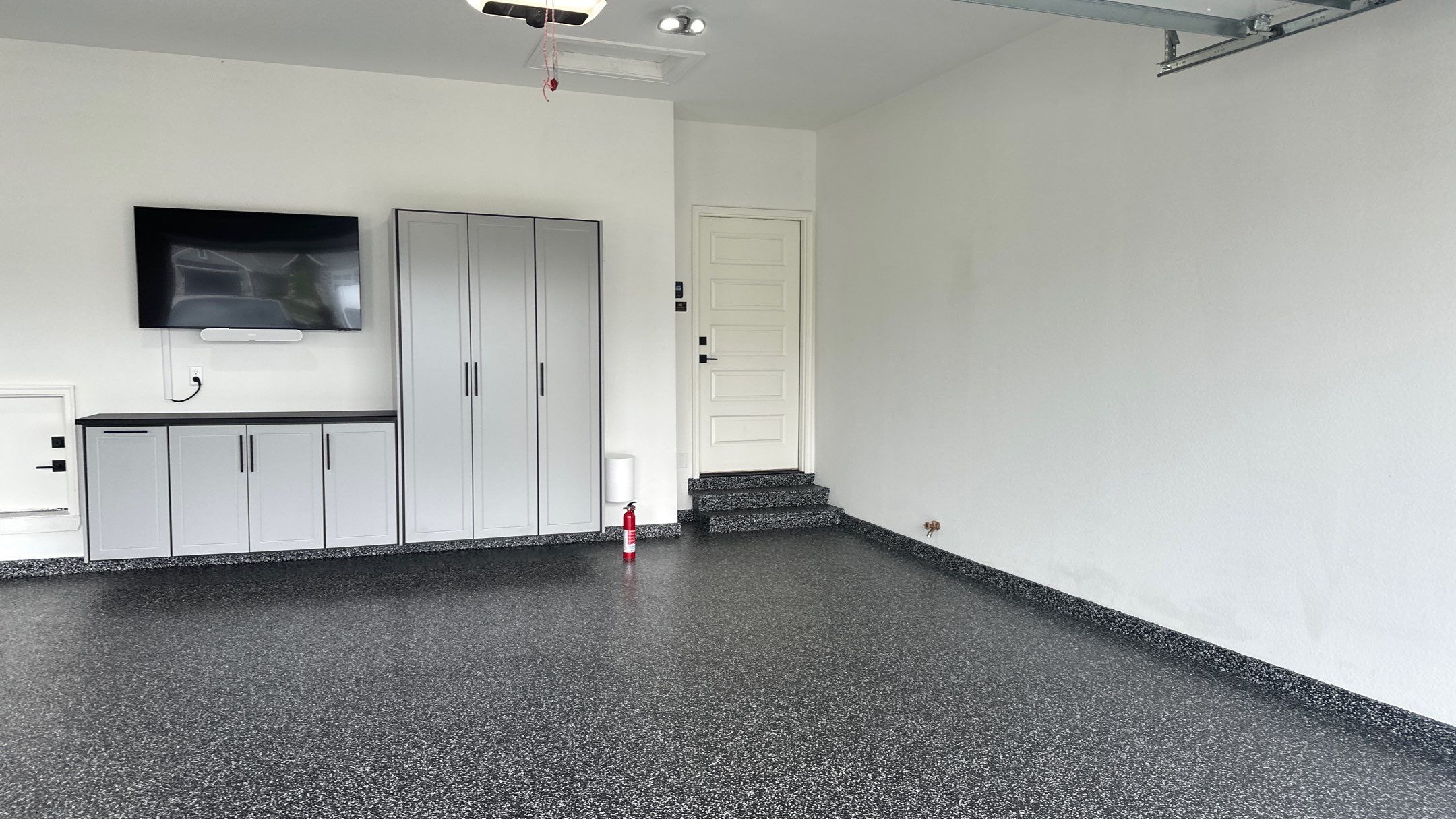 John H. received his dream garage with cabinets and a Banner Garage Floor by Banner Garage