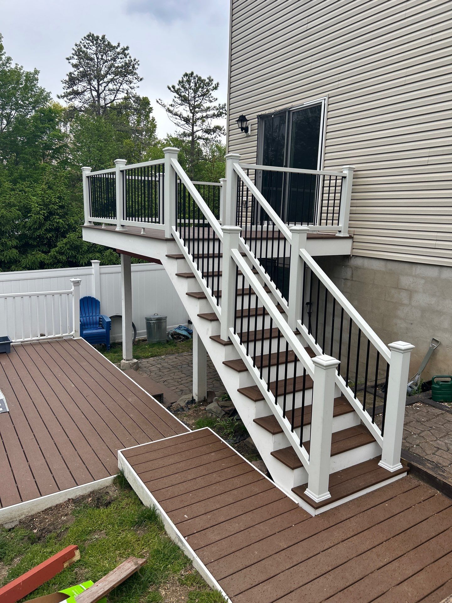 Elevated Composite Deck Replacement with White Railing in Tannersville by Herts Roofing & Construction