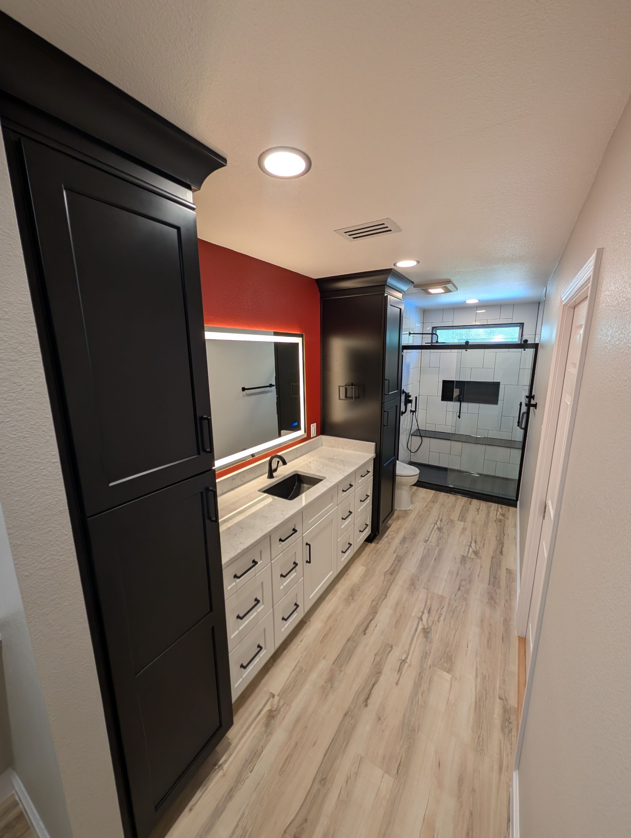 Universal City Tub-to-Shower Conversion with Built-In Bench and Backlit Mirror by Legacy Bath and Kitchen 