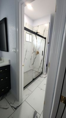 Monochromatic Bathroom Remodel featuring Walk-In Shower