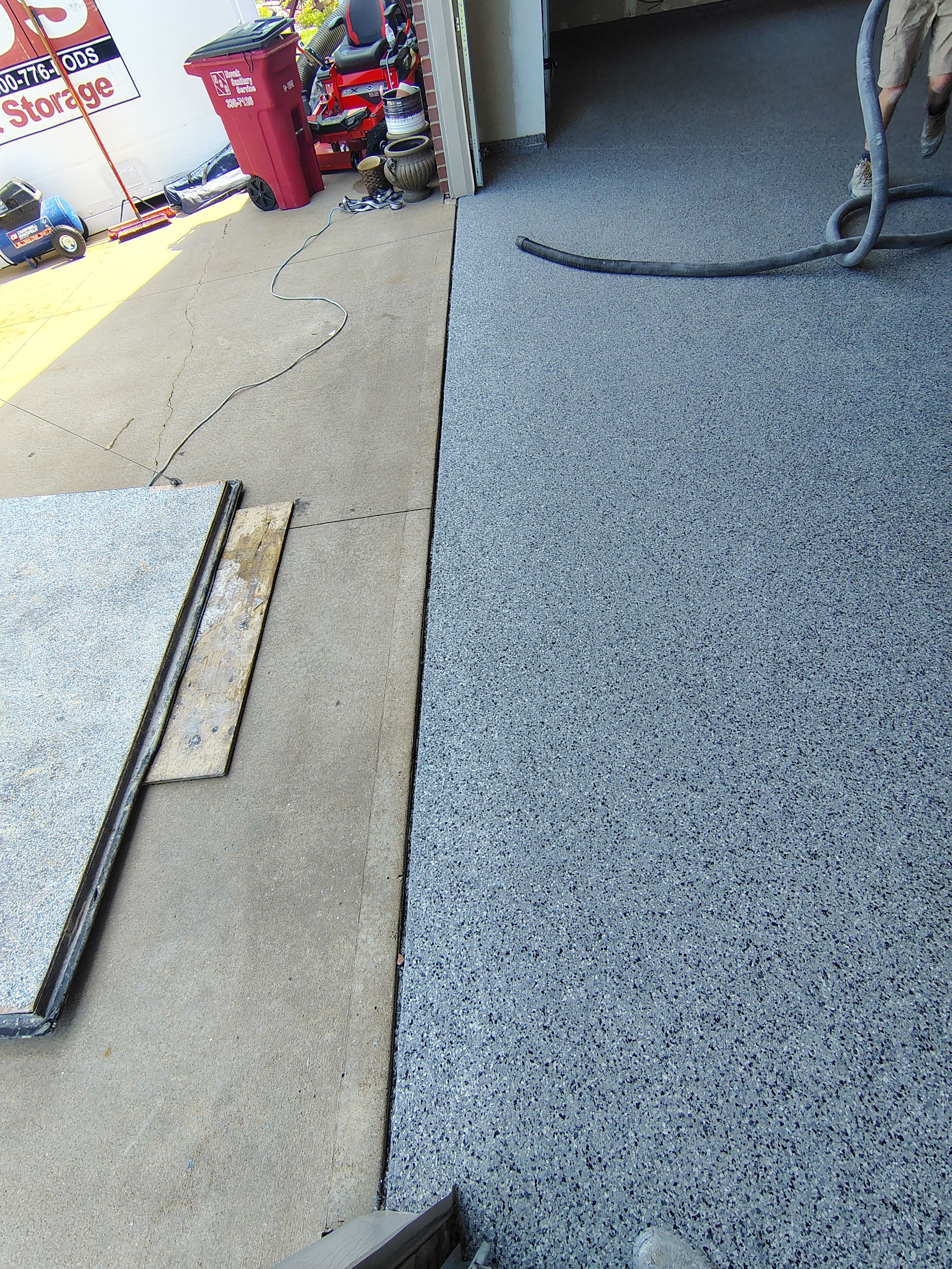 Sioux Falls Garage Concrete Grinding and Nightfall Decorative Chip Coating by Select Painting, Coatings & Garage Cabinets