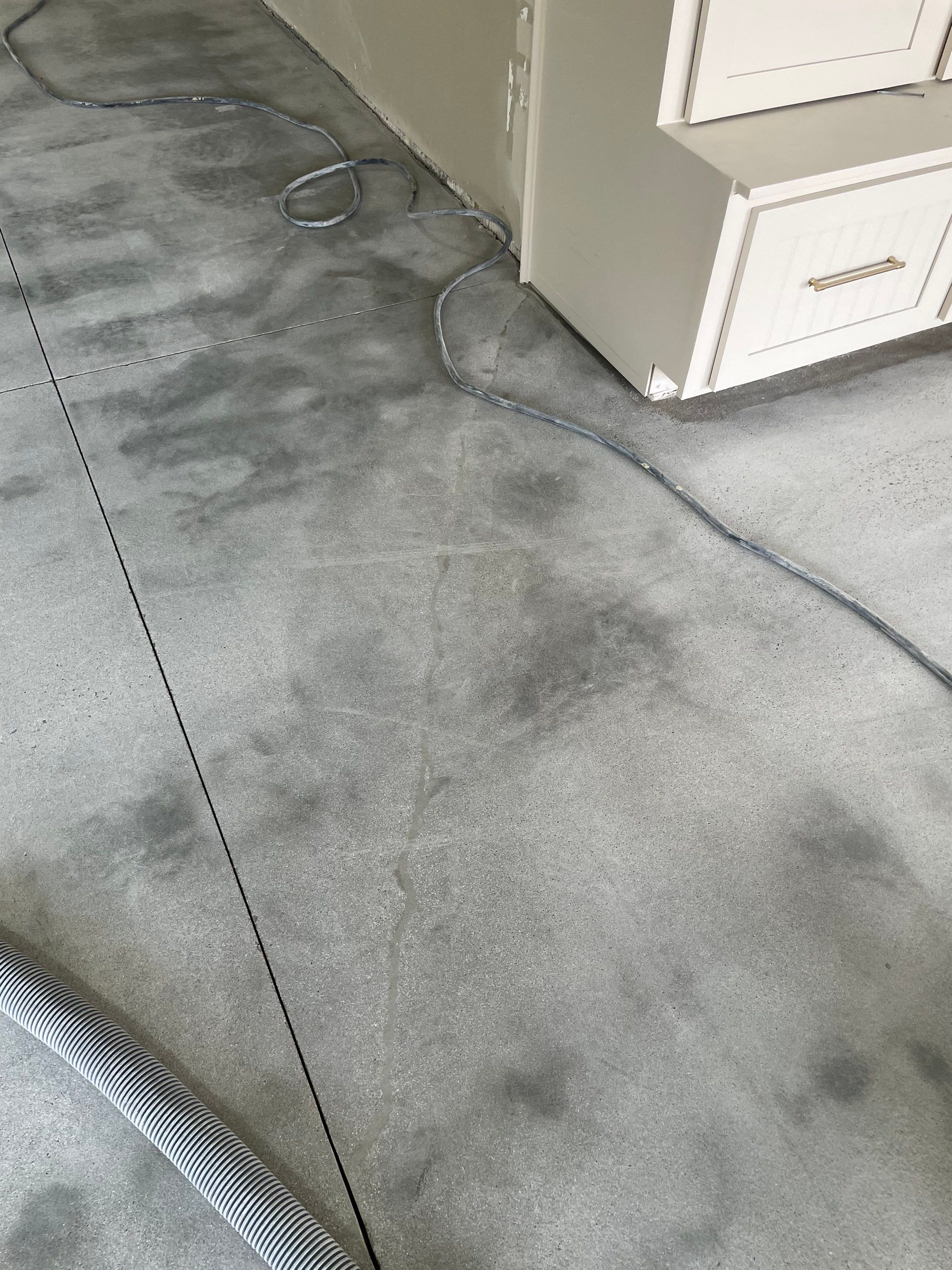 Cabin FEver Flake Garage Floor Coating Installation in Sioux Falls by Select Painting, Coatings & Garage Cabinets