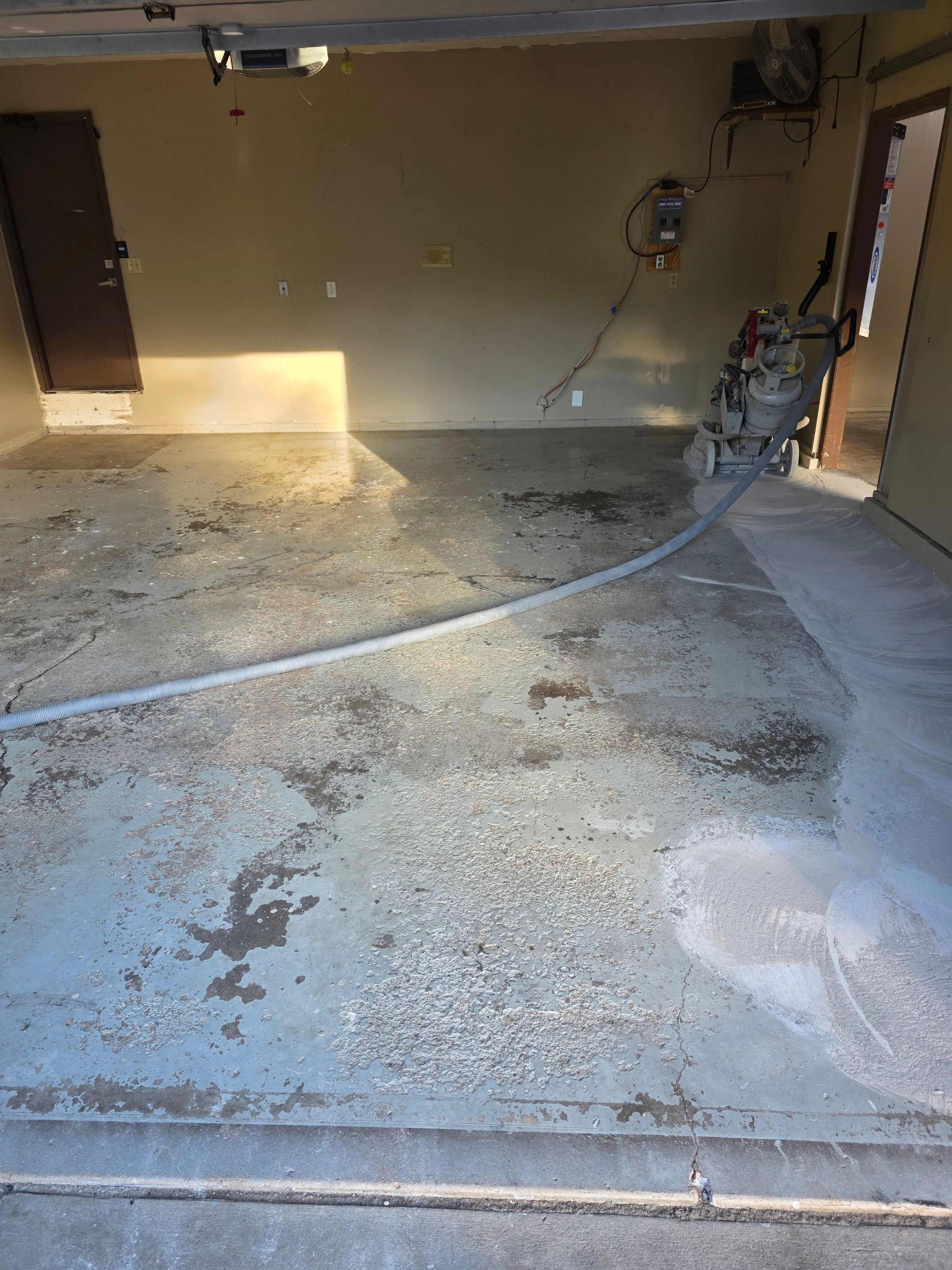 Residential Garage Epoxy Floor Coating Installation in Sioux Falls by Select Painting, Coatings & Garage Cabinets