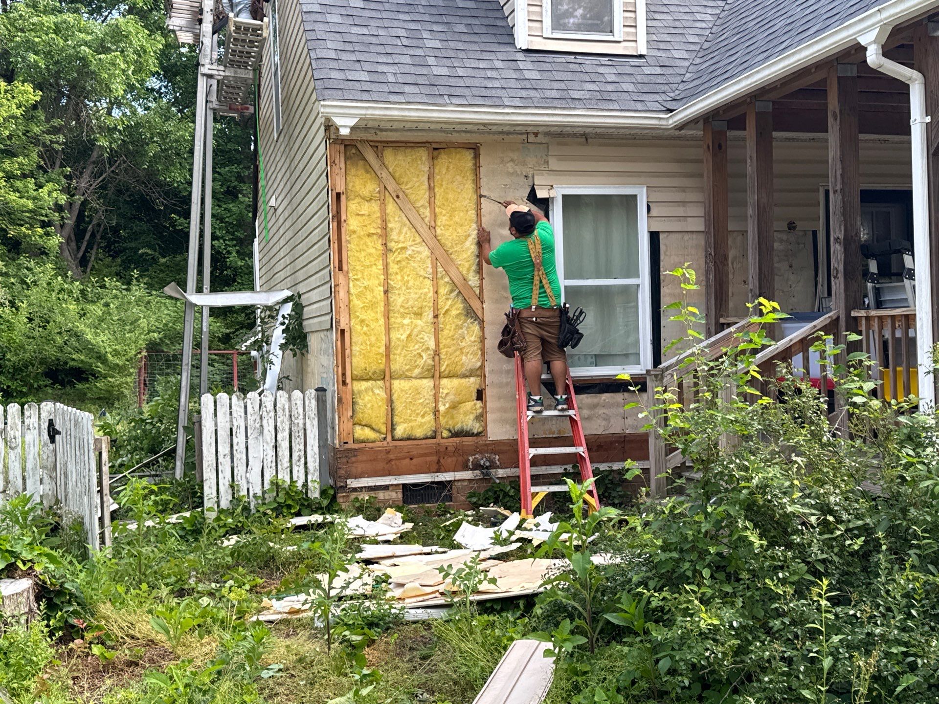 Gloucester Exterior Overhaul with Navy Blue Siding and New Roof by Cade Construction