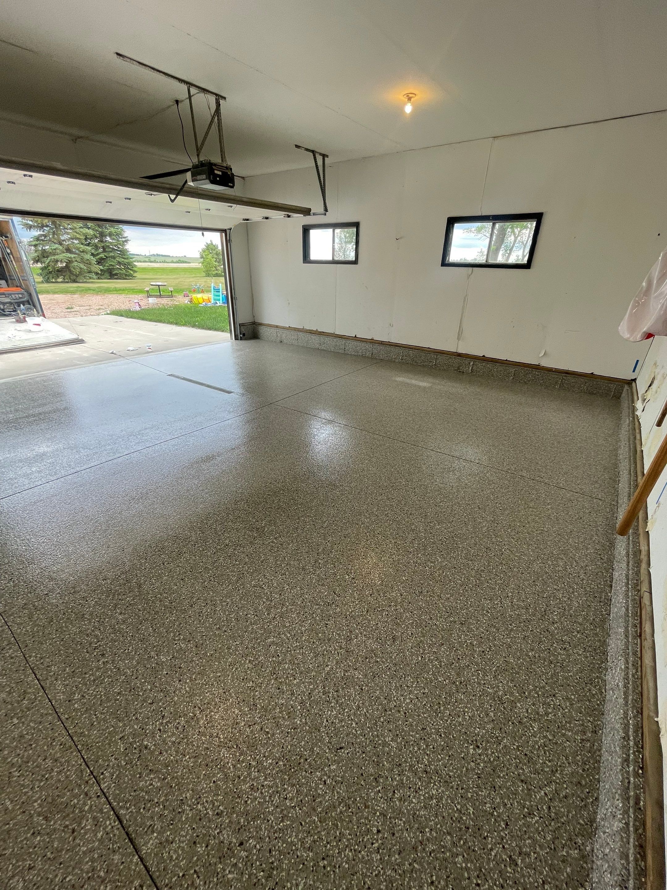 Hartford Residential Garage Floor Transformation With Decorative Chip Coating by Select Painting, Coatings & Garage Cabinets