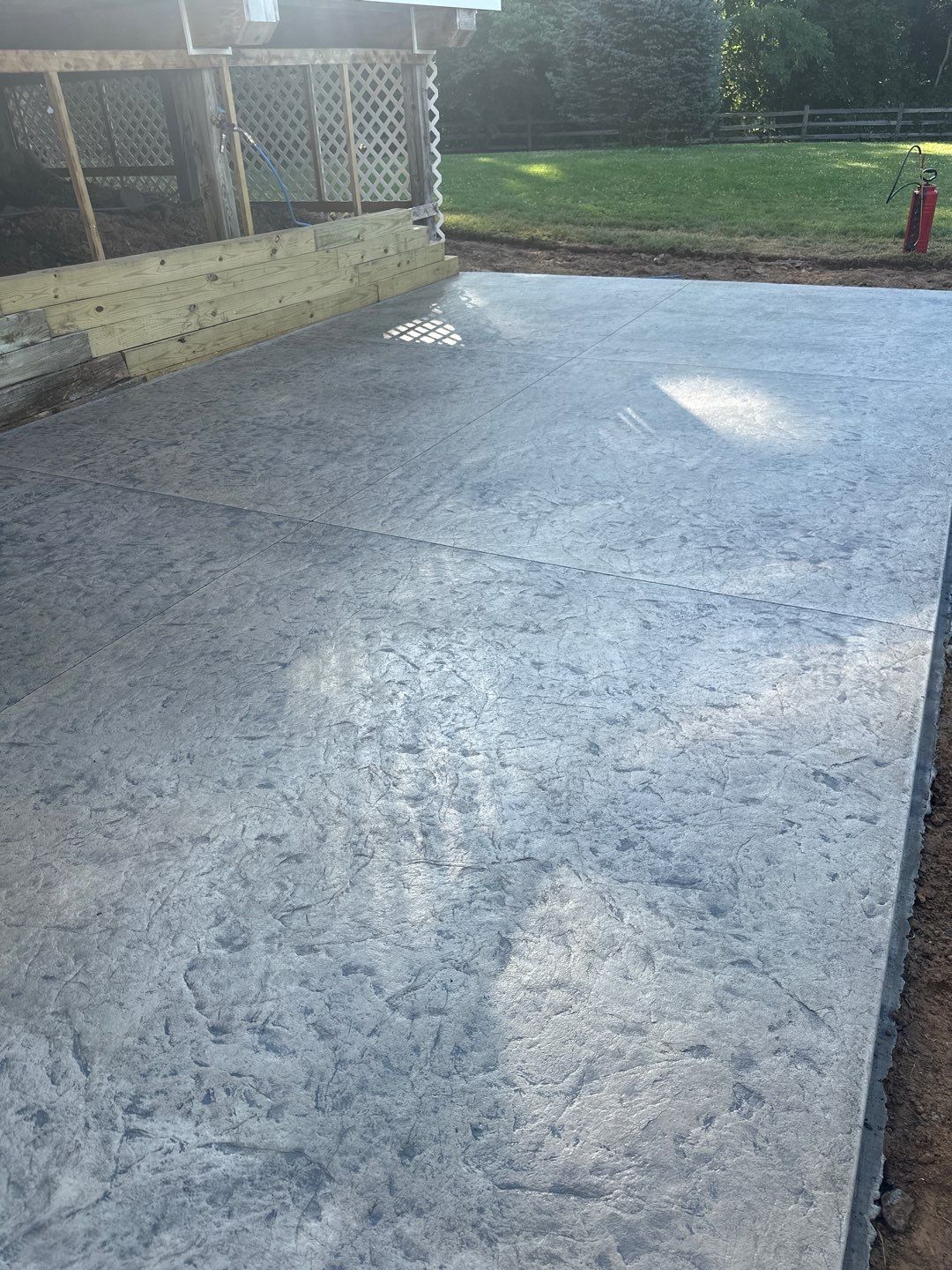 Rolled slate stamped patio  by NG Masonry & Construction LLC