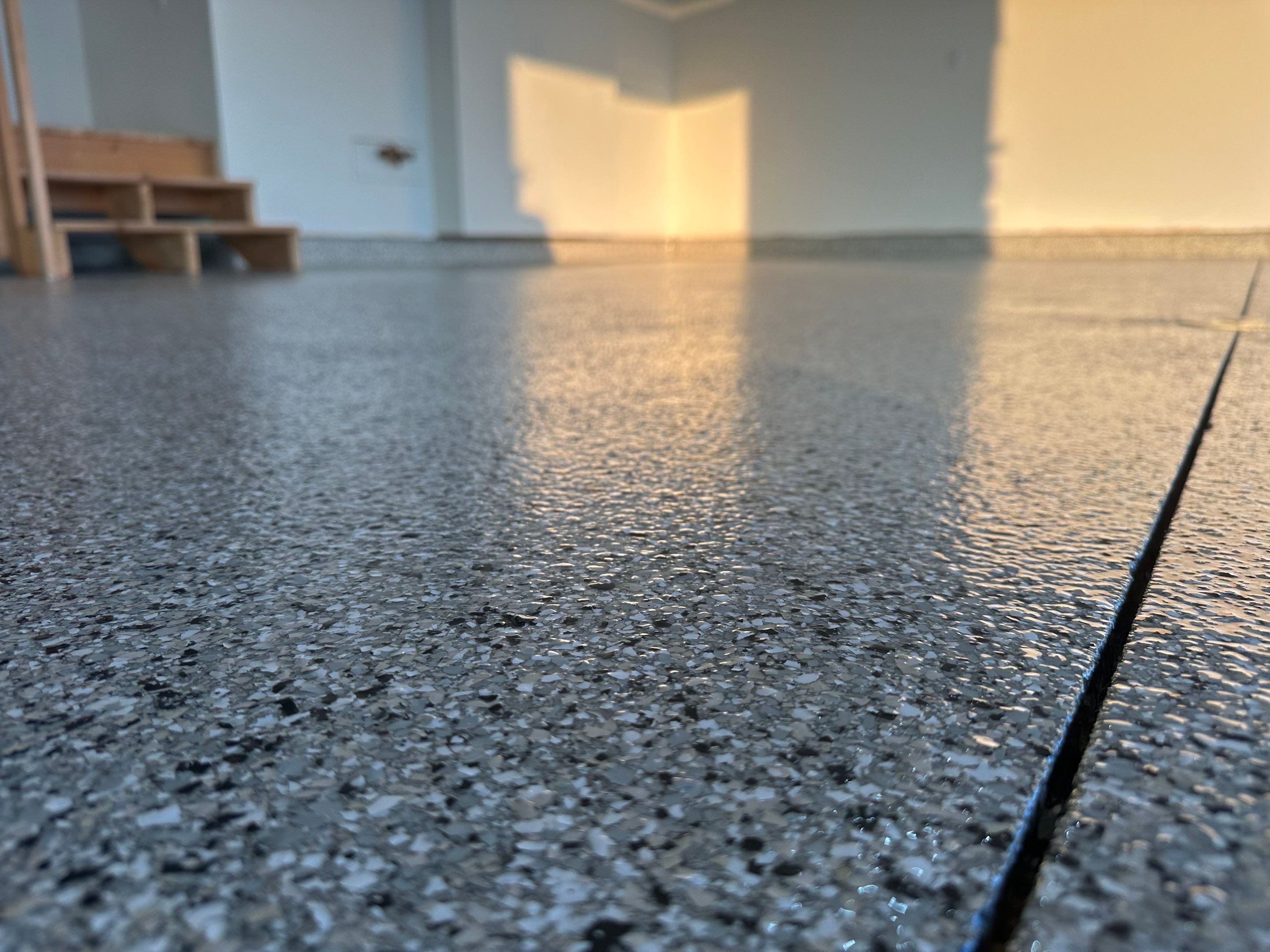 Cabin Fever Decorative Flake Garage Floor Coating in Sioux Falls by Select Painting, Coatings & Garage Cabinets
