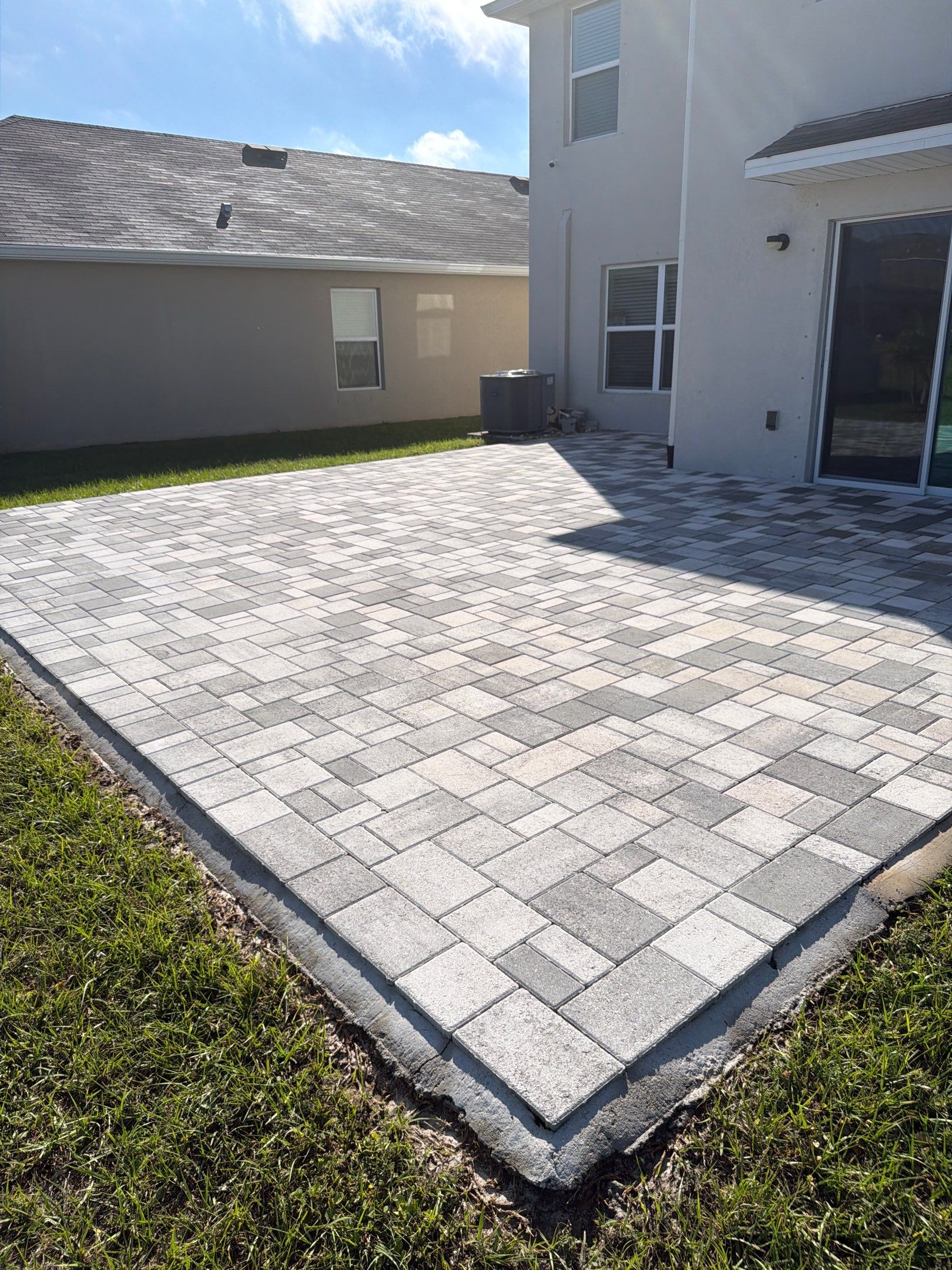 Paver Sealing and Restoration for Large Multi-Toned Patio in Wimauma by Supreme Paver Experts