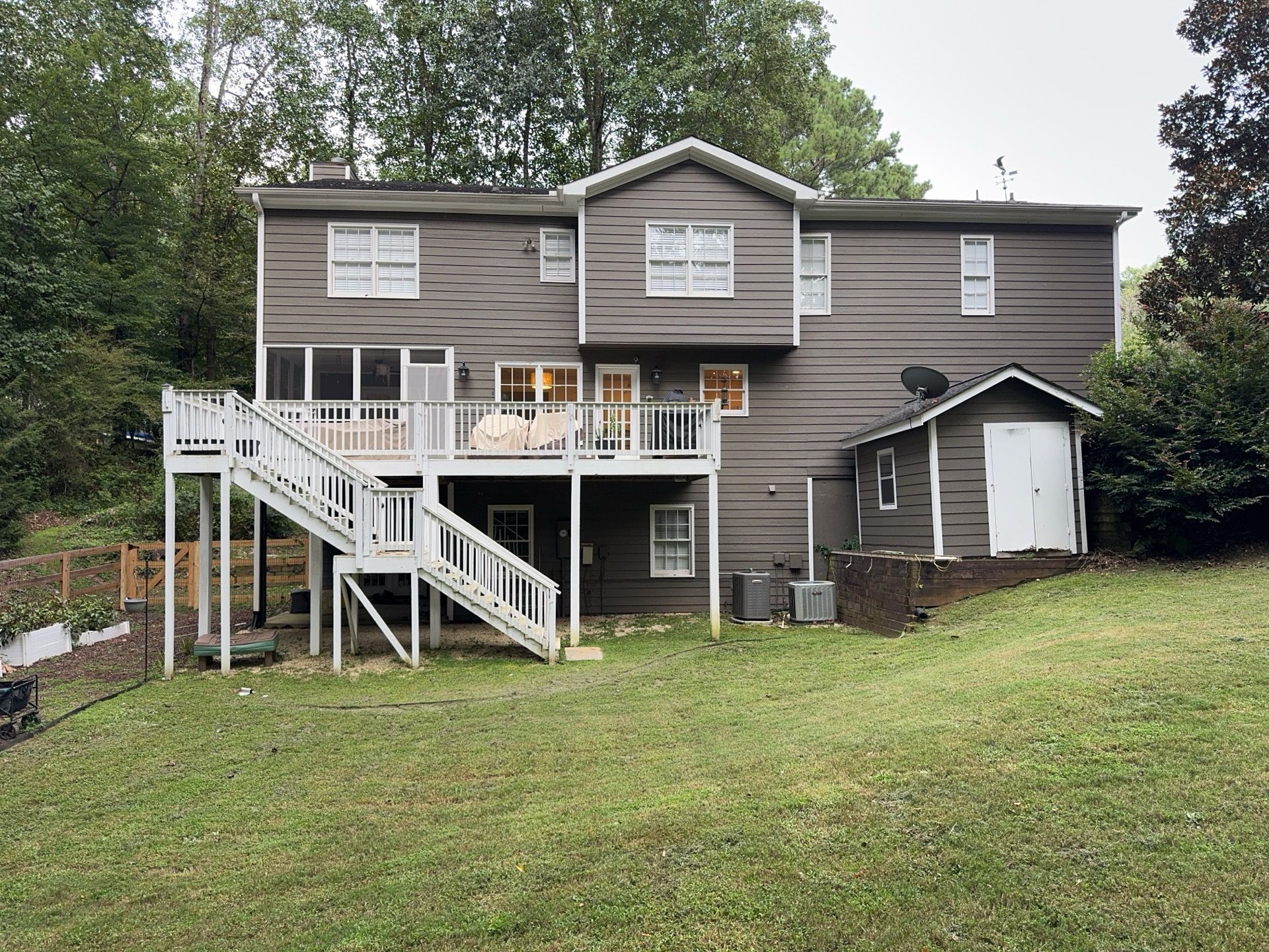 Marietta, GA Full Siding Replacement, 30+ Window Replacements, Screened-In Porch to Sunroom Conversion, Gutter Replacement, and Exterior Painting by Nelson Exteriors