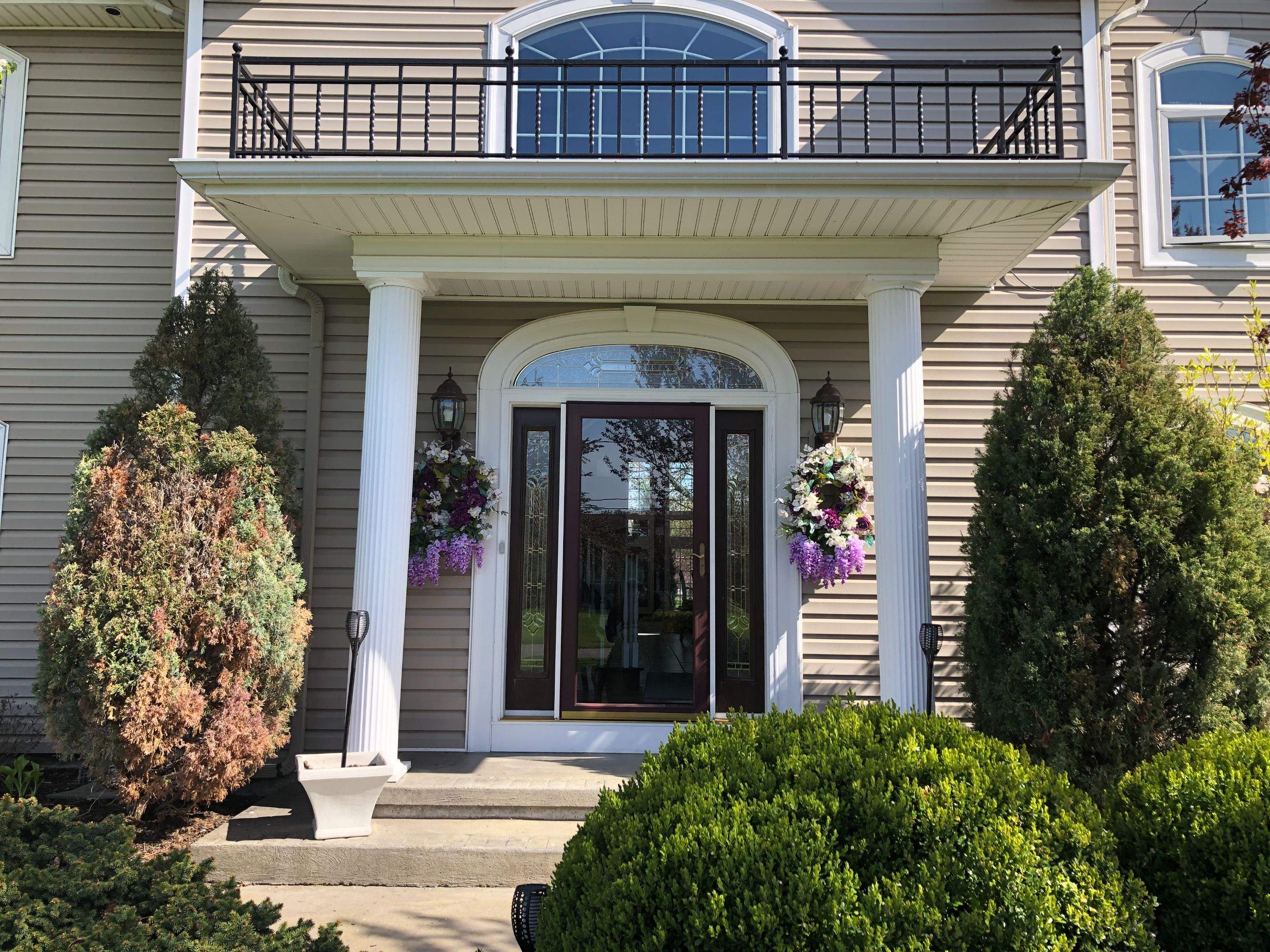 Exterior Renovations- Siding, Concrete, Railings, and Entry Door  by Ivy Lea Construction