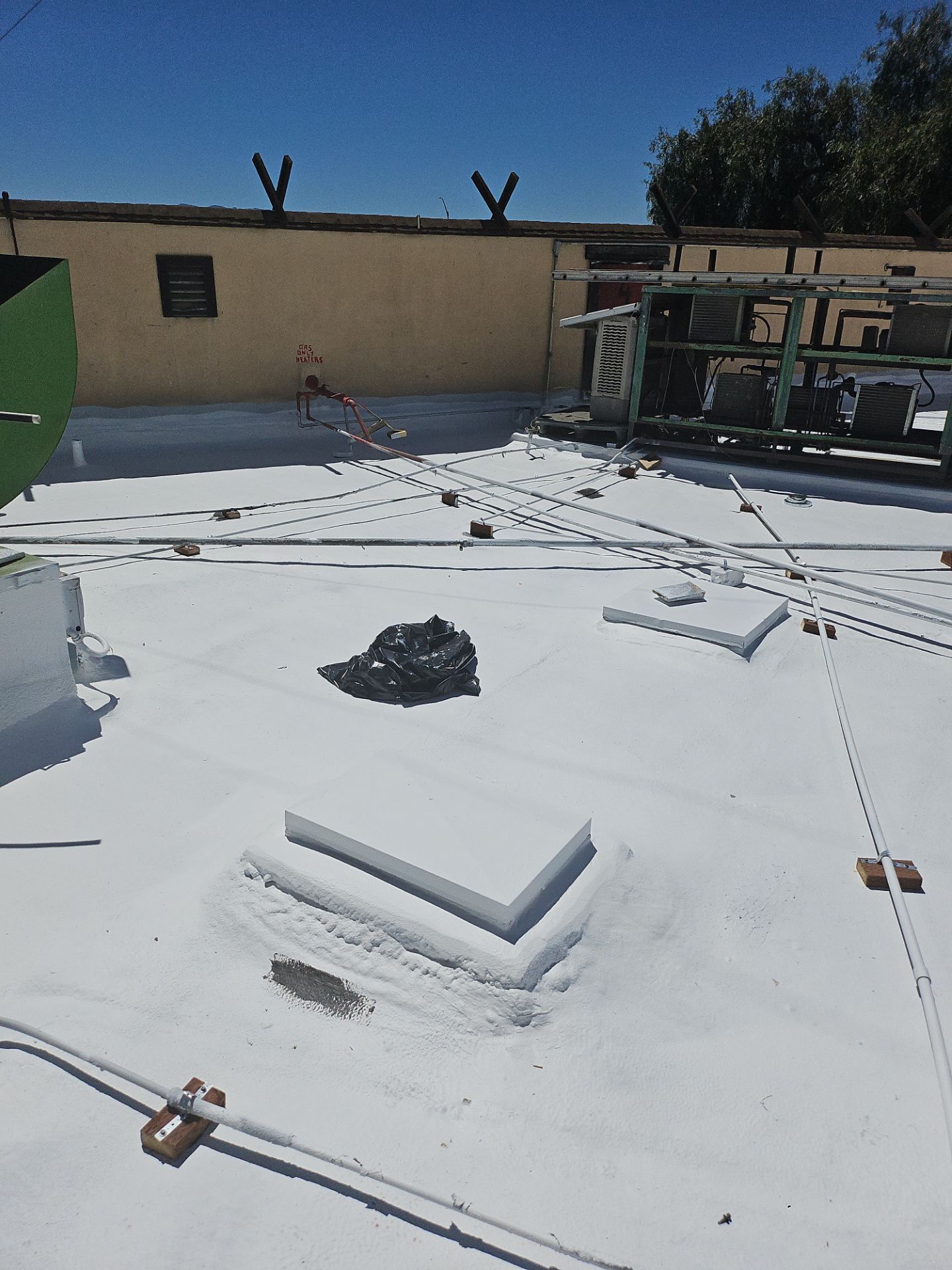 Spray foam and coatings using General Coatings acrylic coatings and spray foam by Straight Edge Roofing Inc