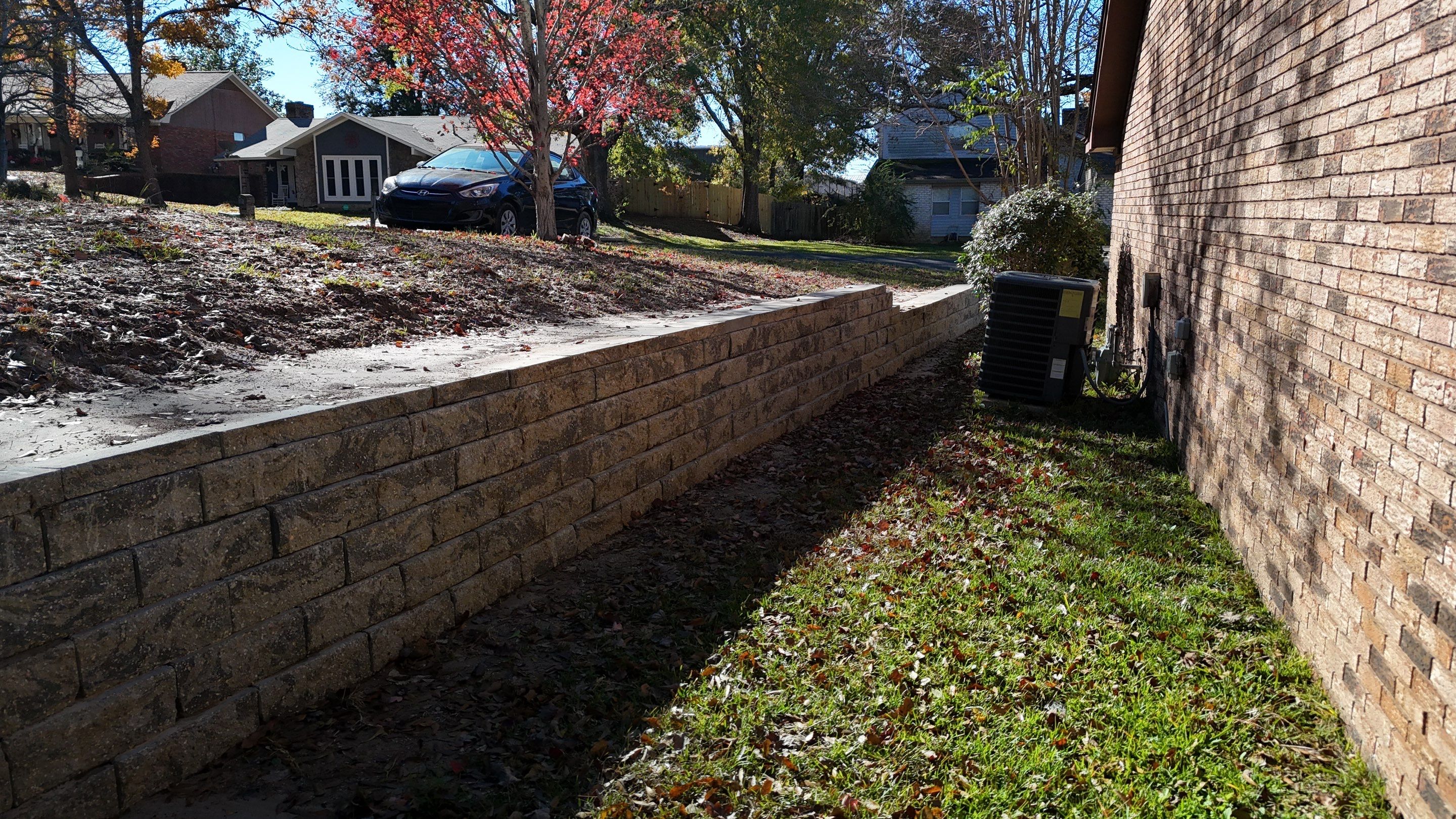 Elegant Stone Retaining Wall by Roberson Construction LLC