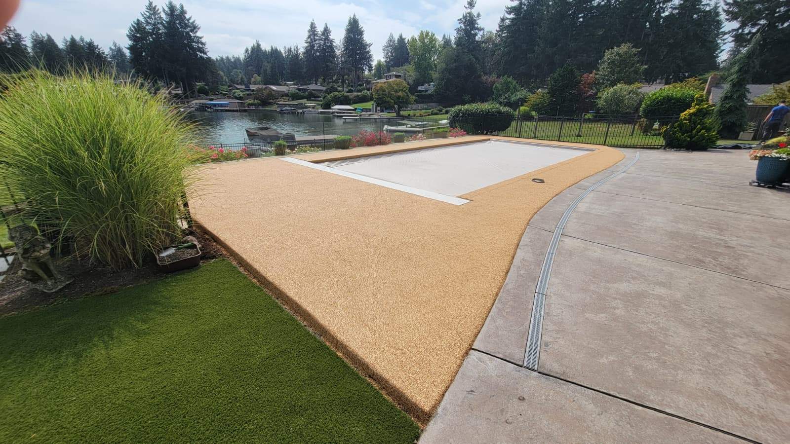 Pool Deck with Rubber Stone Finish by Concrete Coating Experts Inc.