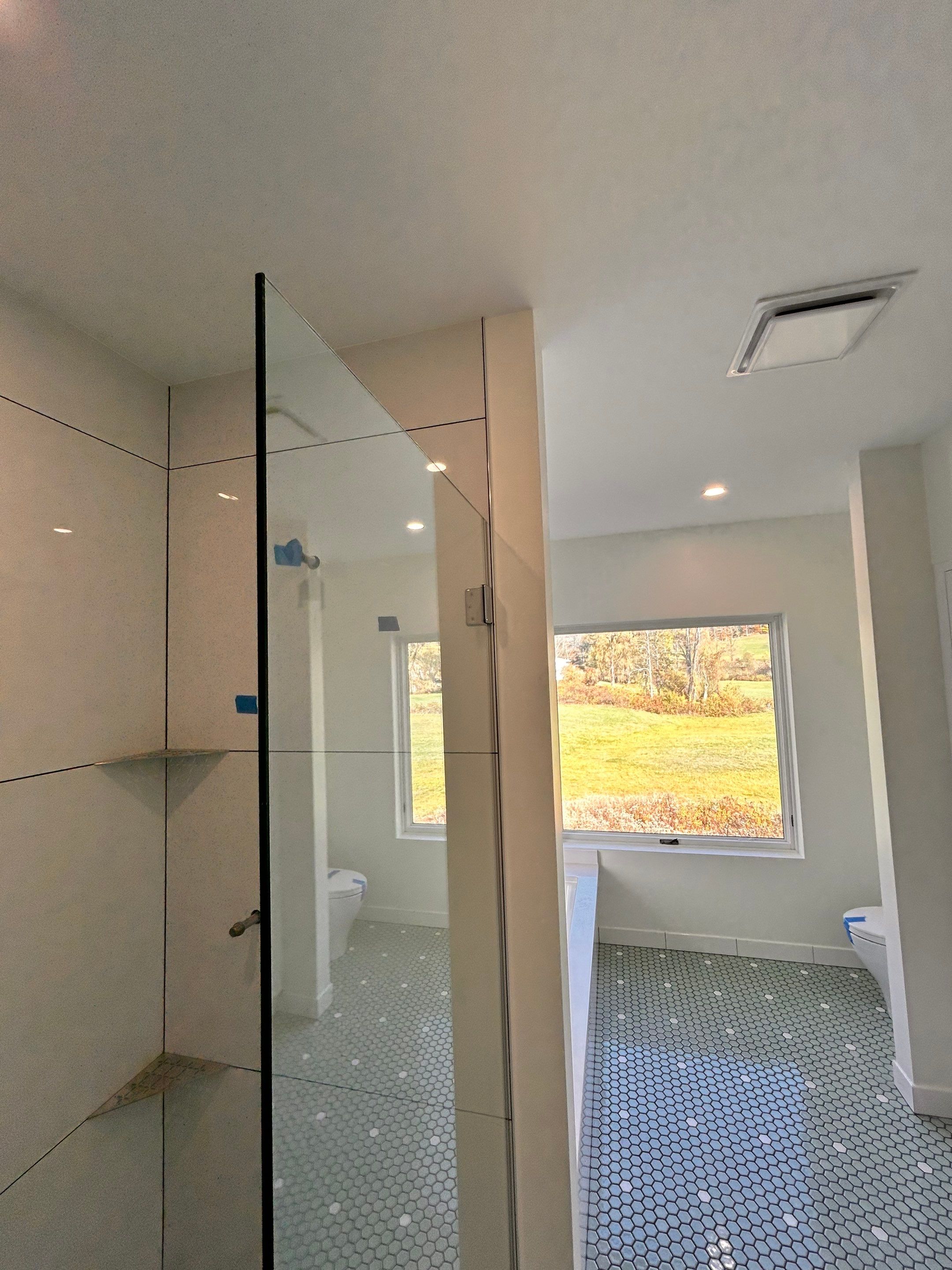 Frameless Spray Panel using Tempered Shower Glass by Cheshire Glass Company