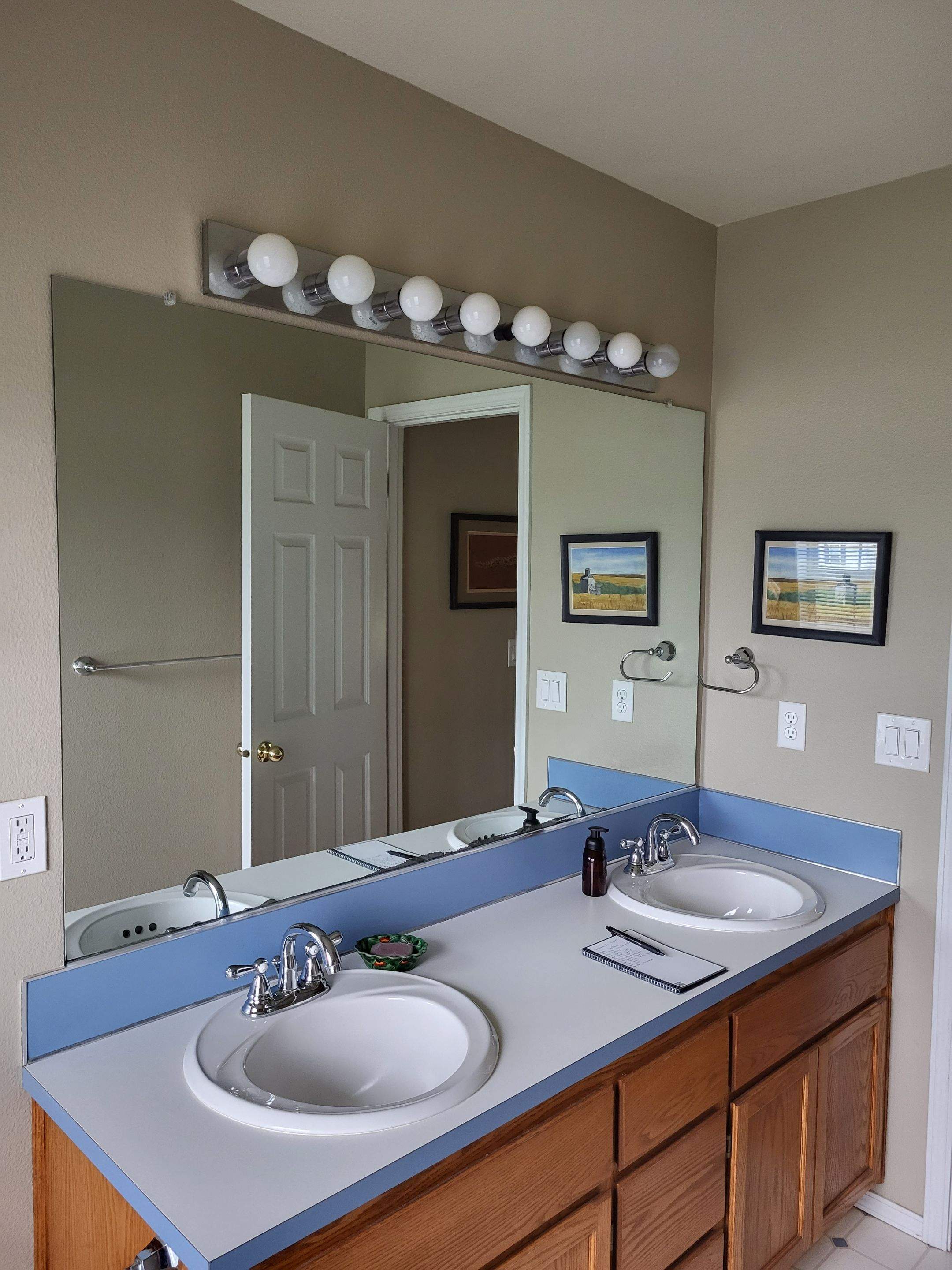 Milwaukie Dual Bathroom Remodel by American Made Construction 