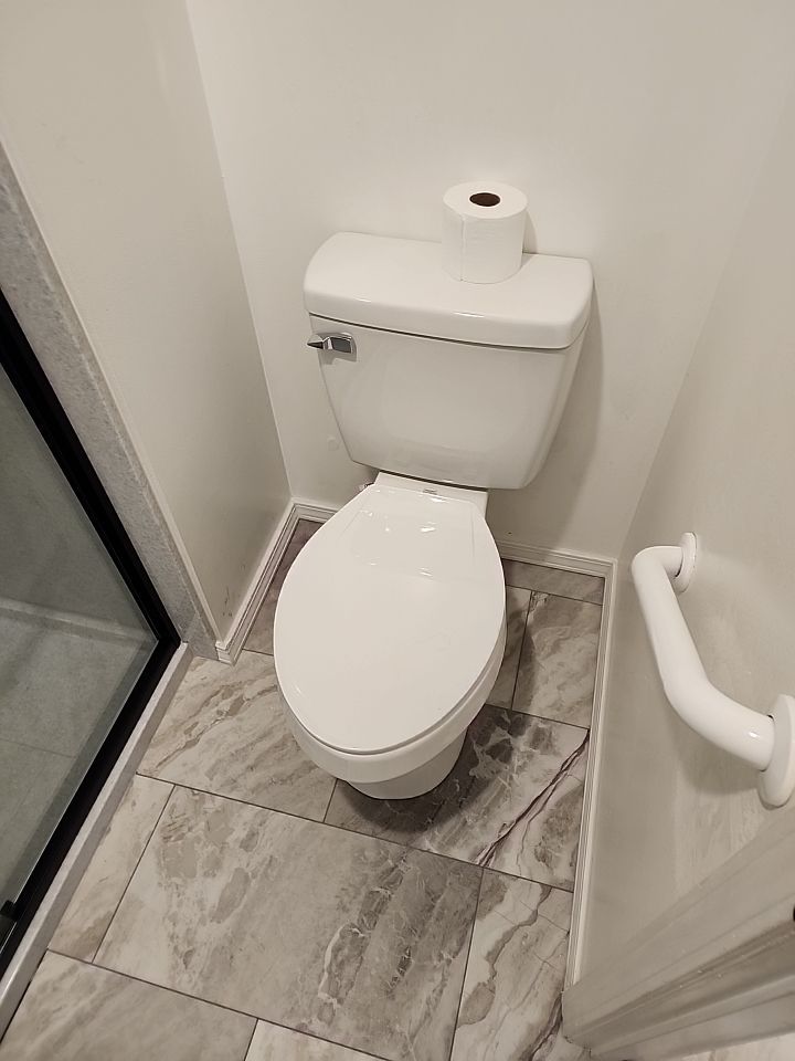 New shower, flooring, and countertop by The Shower Company