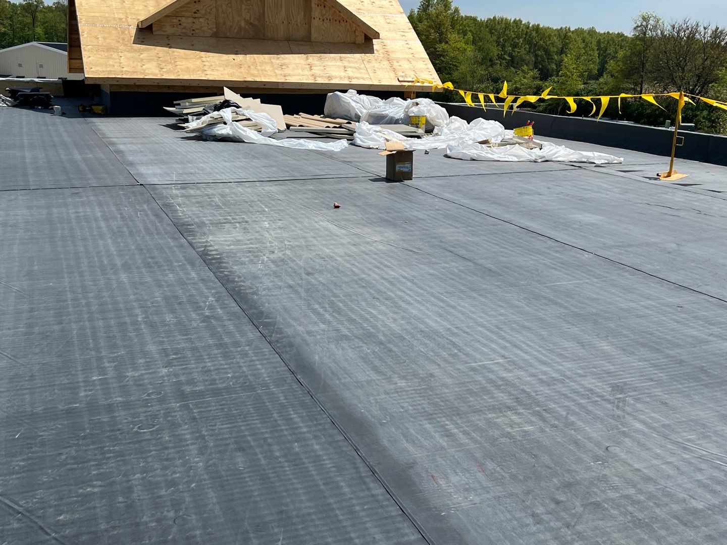 Commercial Roofing Installation using 60 mil rubber roof  by Nitro Roofing and Construction
