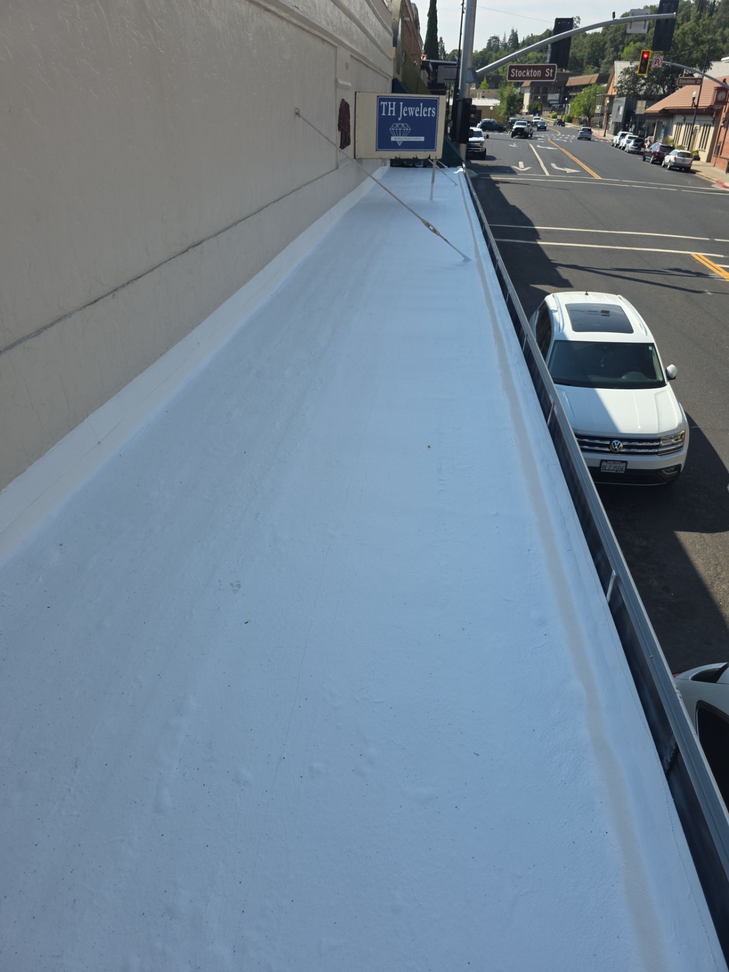 Foam and coatings on commercial roof by Straight Edge Roofing Inc
