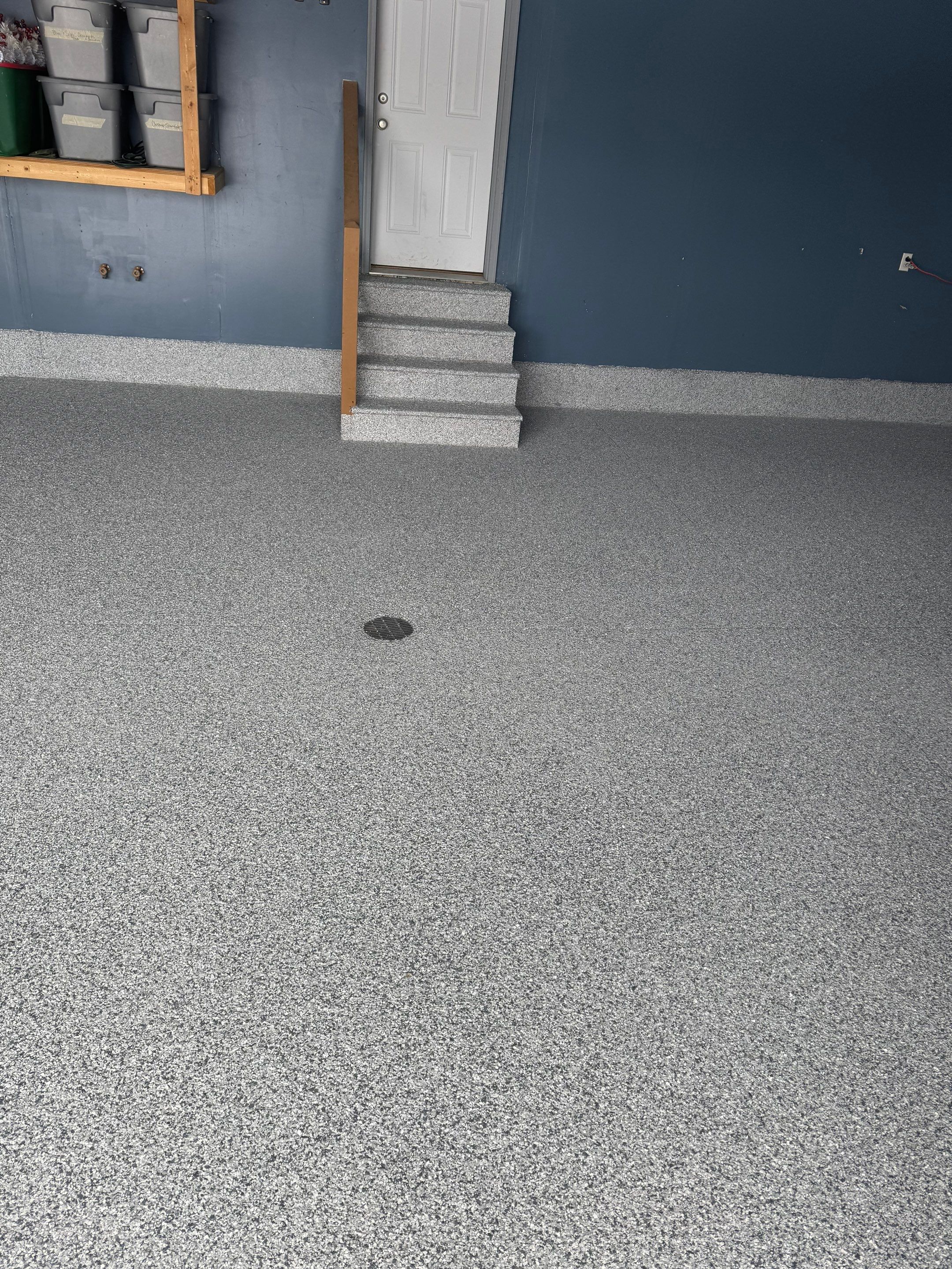 Grey Speckled Epoxy Garage Floor and Stair Coating in Sioux Falls by Select Painting, Coatings & Garage Cabinets