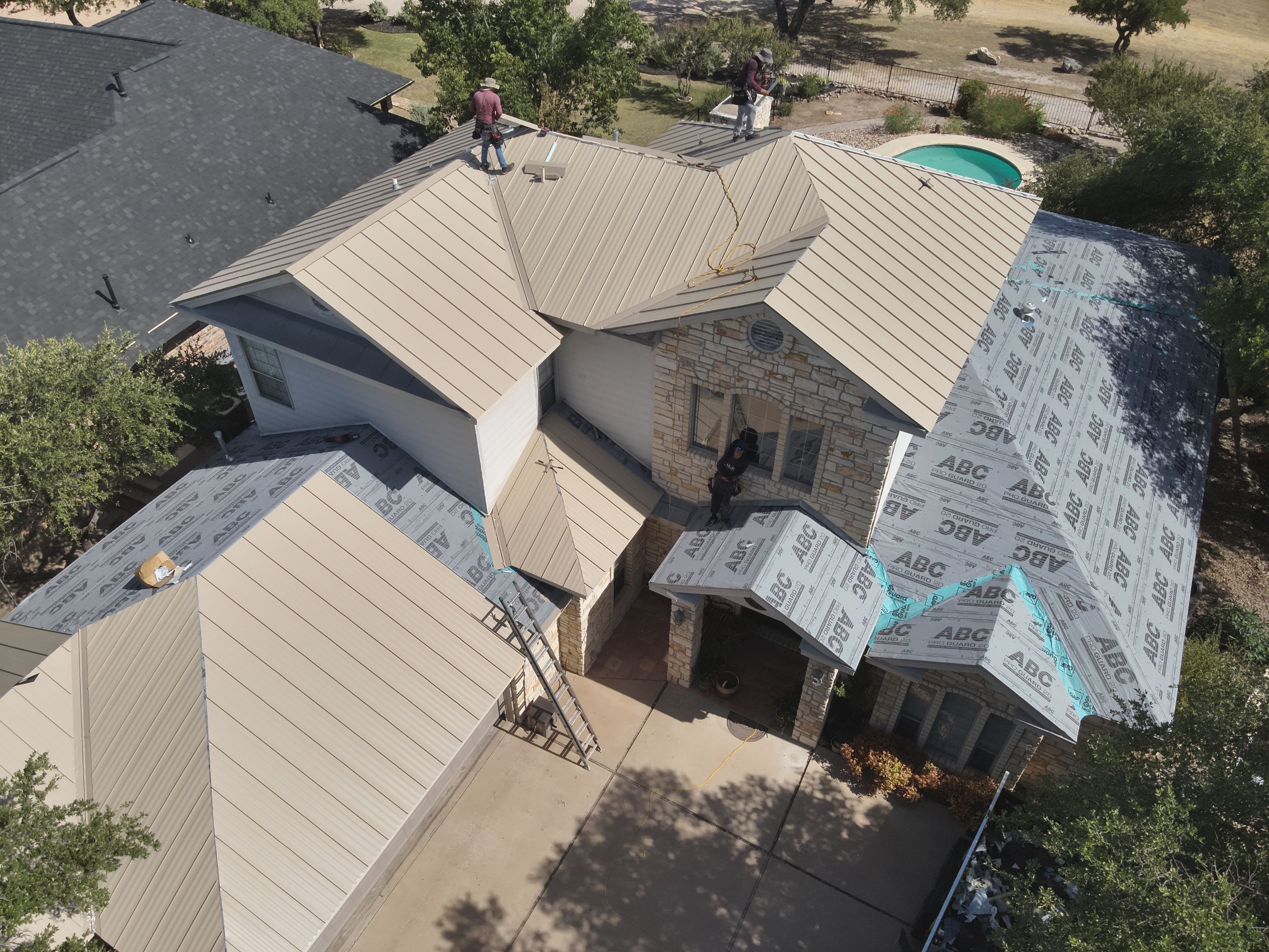 Residential Roof Replacement using 24 GA Double-Lock - Surrey Beige by Action Exteriors Austin