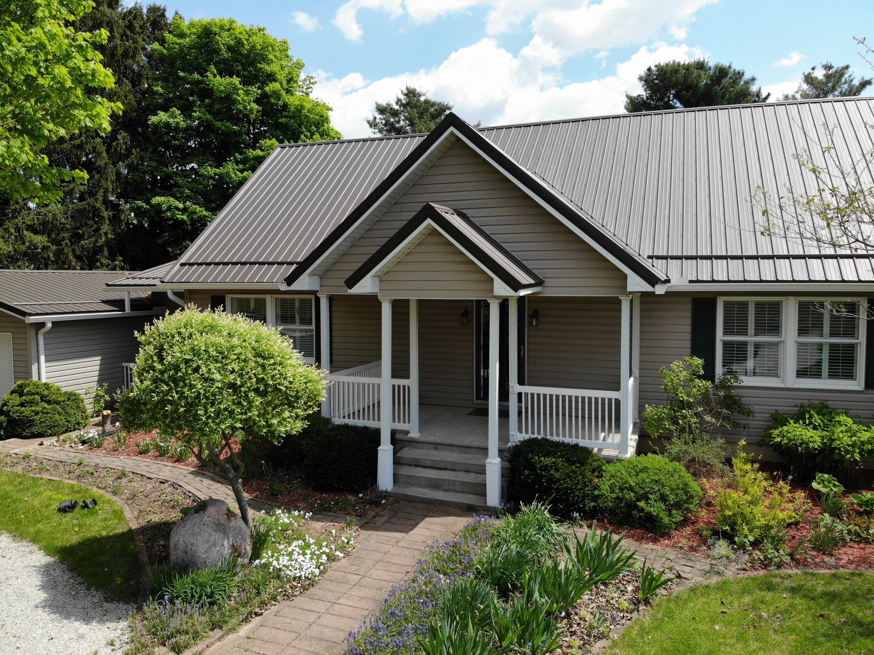 Burnished Slate Exposed Fastener Metal Roof That Withstood a Tornado in Ligonier, Indiana by 4Ever Metal Roofing