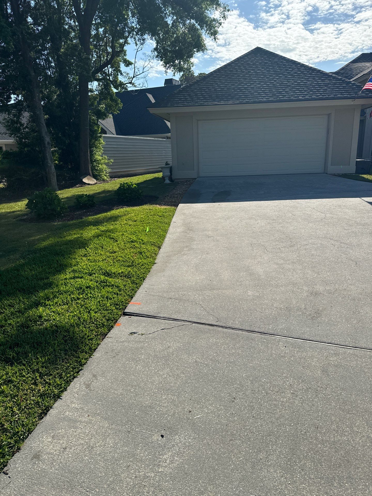 Concrete Driveway Repair with Decorative Paver Accents in Hilton Head Island by Lowcountry Scapes, LLC