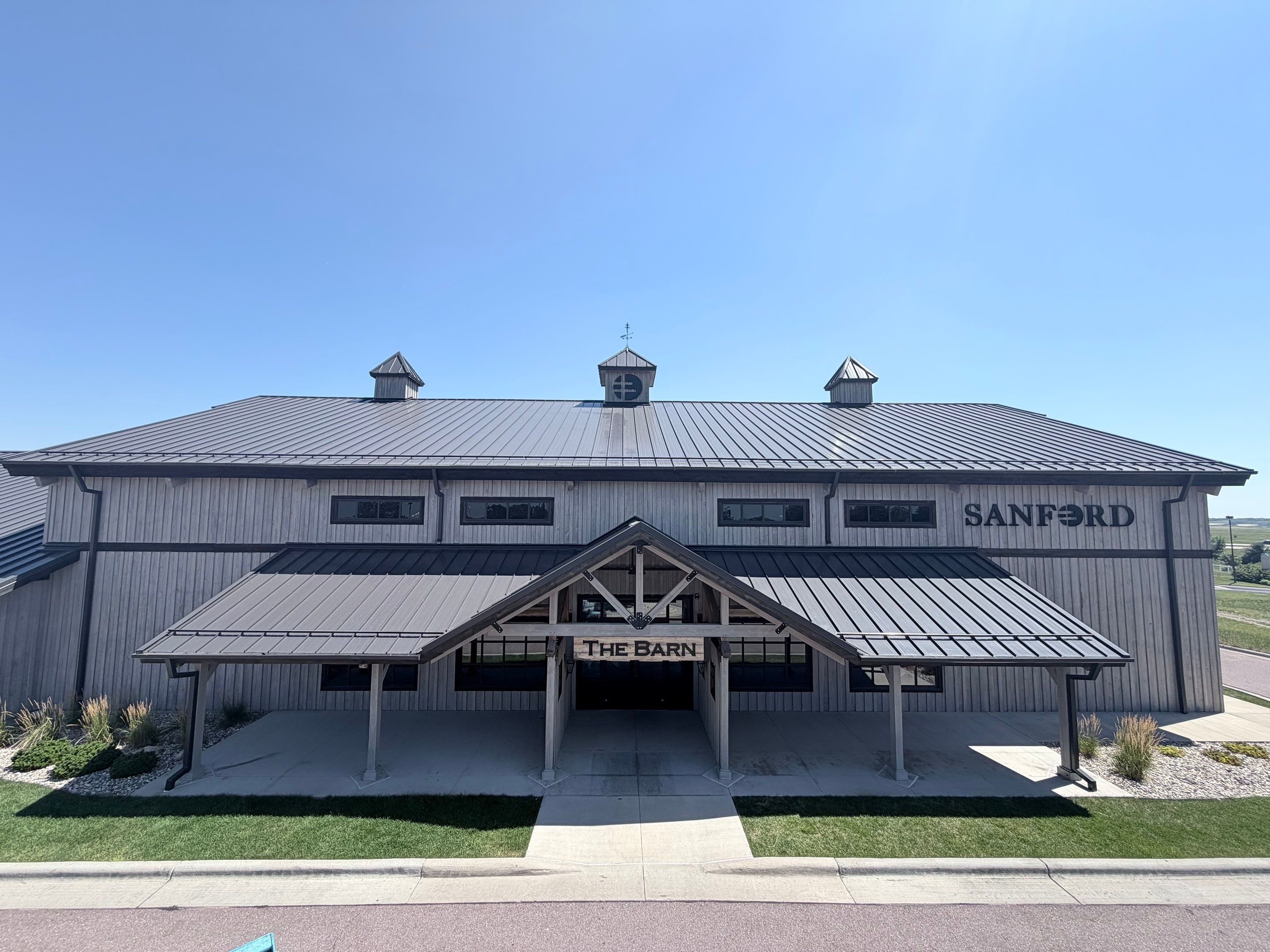 Commercial Exterior Wood Staining for Sanford Barn in Sioux Falls by Select Painting, Coatings & Garage Cabinets