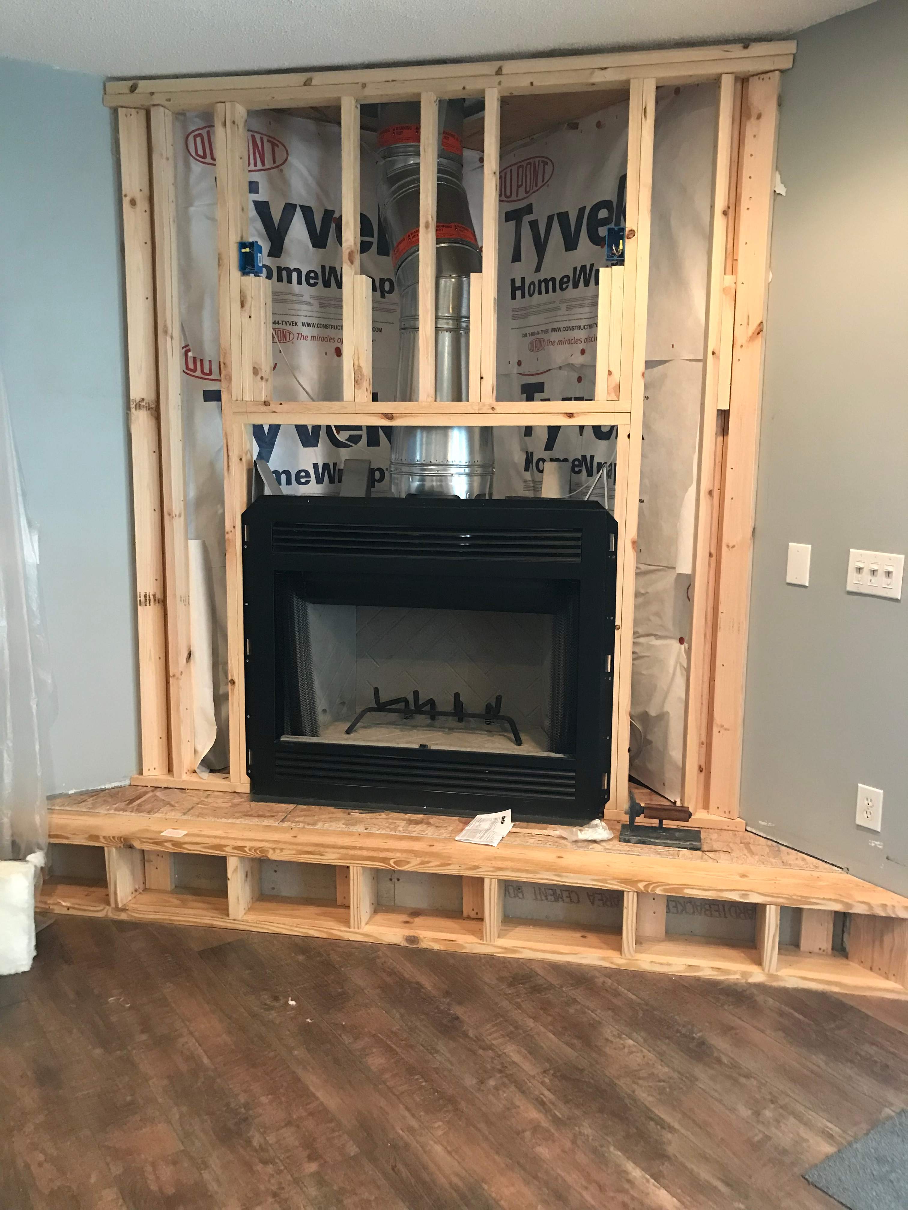 Wood Fireplace + stone + mantel by Premier Chimney and Roofing