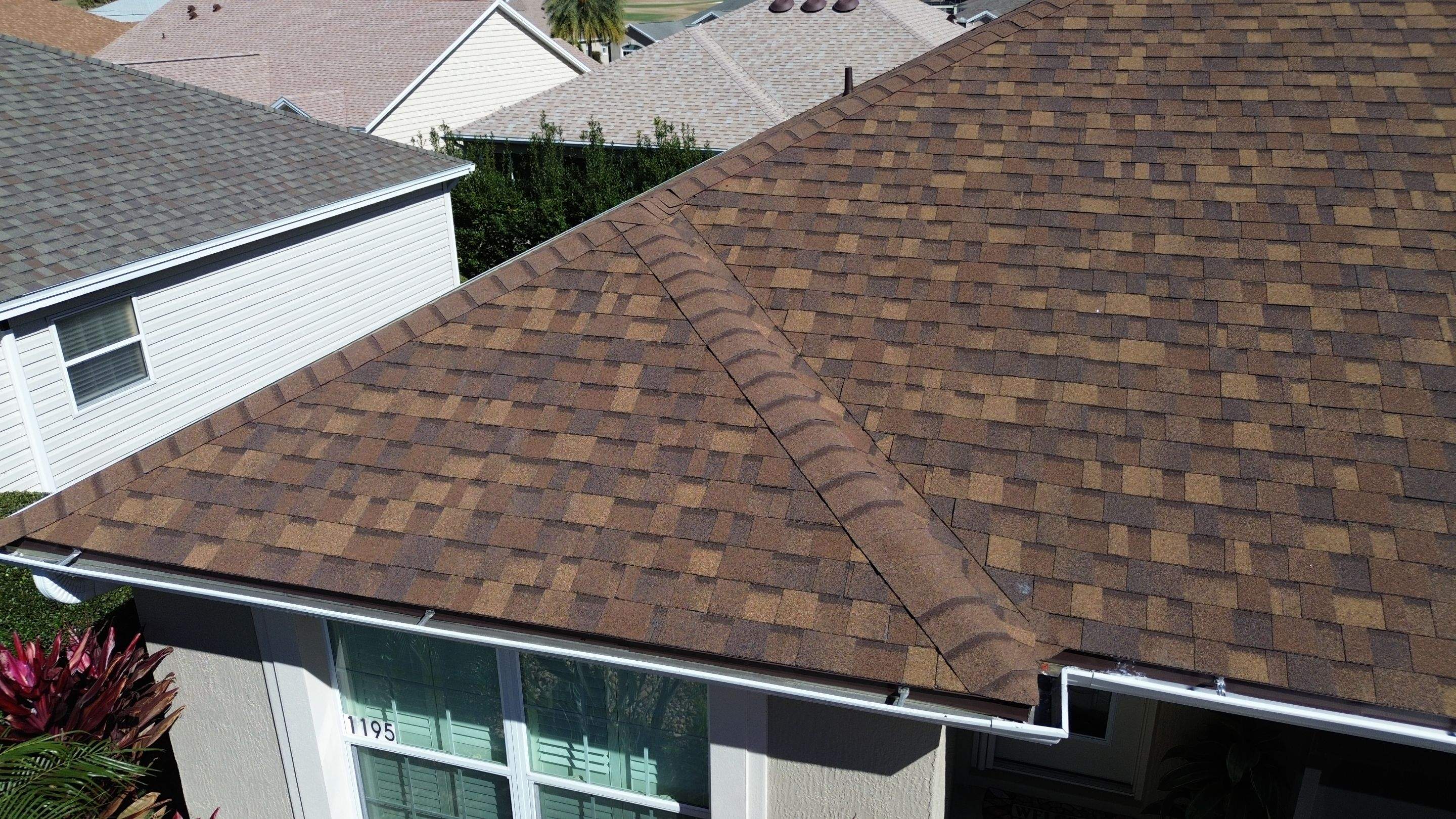 Florida roofers installing shingles by Brehm Roofing