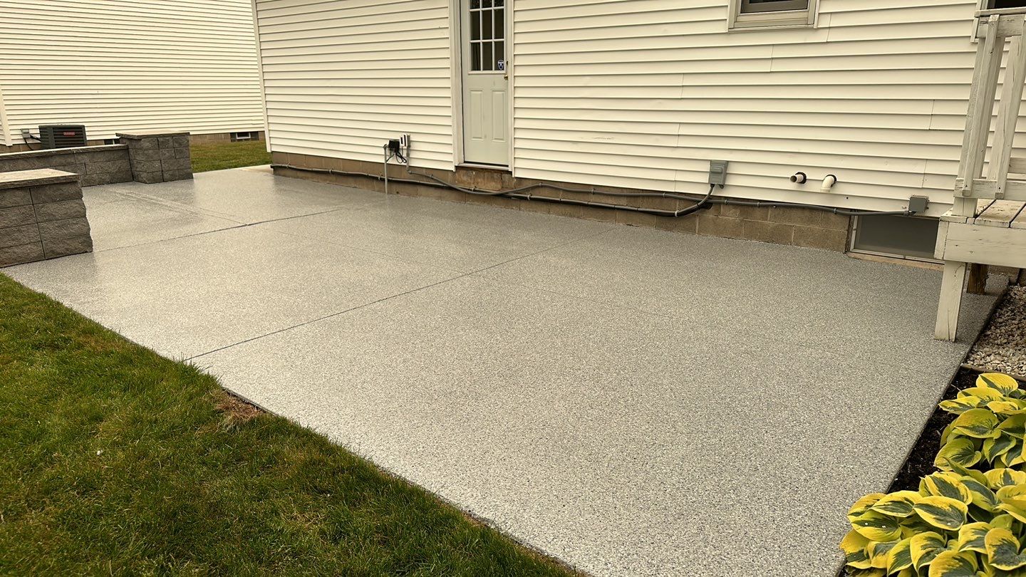 Silverado garage floor and patio coating  by NG Masonry & Construction LLC