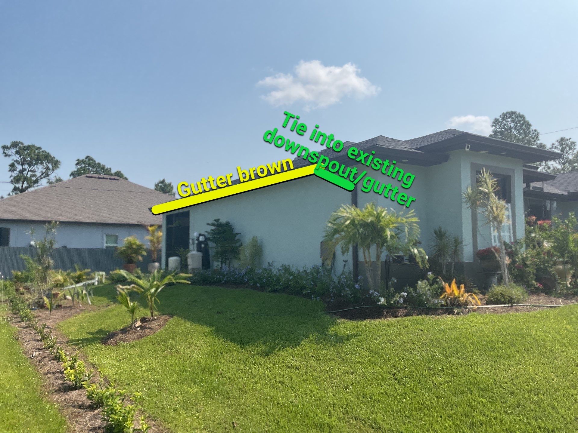 Musket Brown and New Downspouts in Lehigh Acres, FL  by Gutter Professors