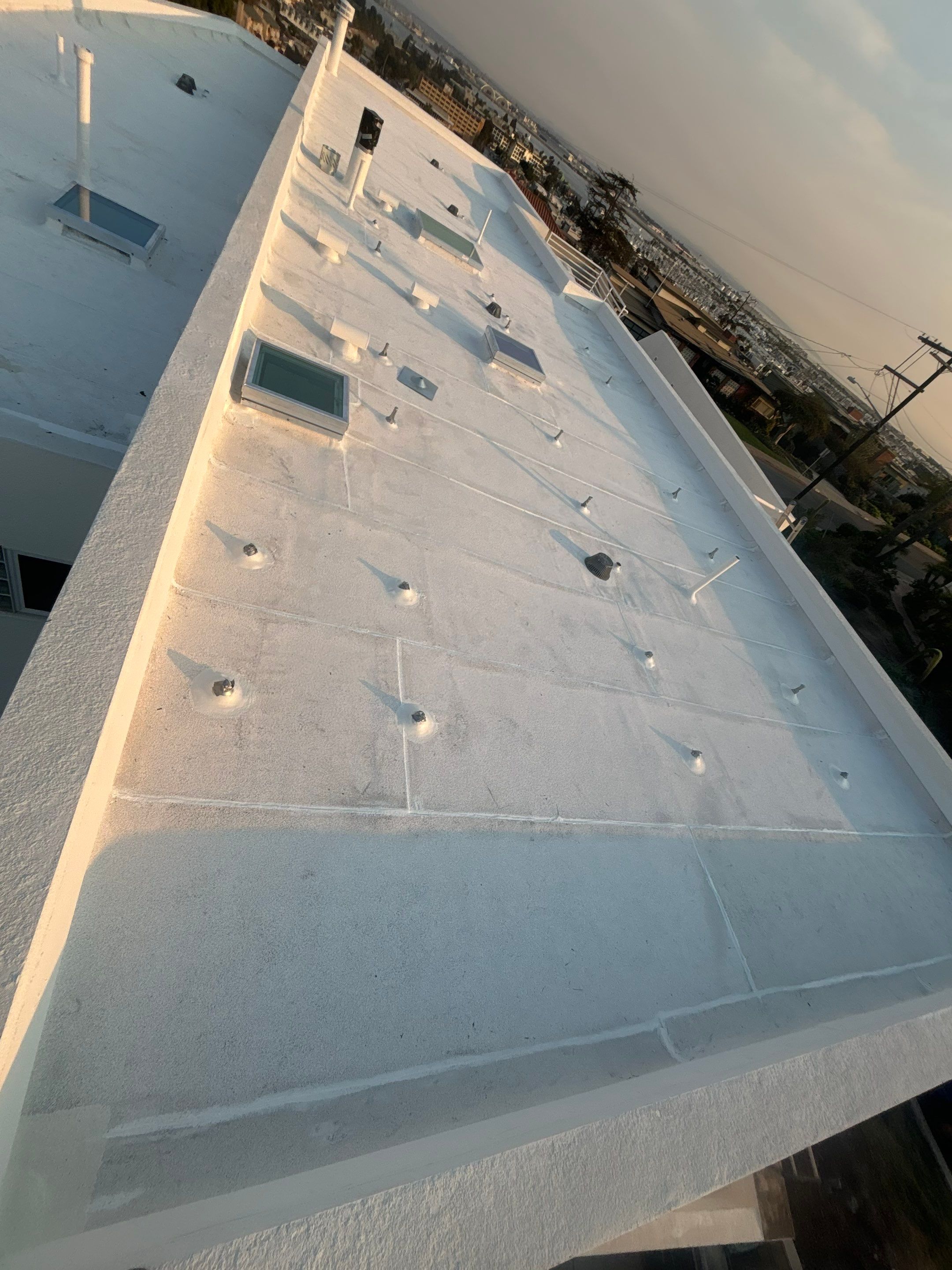 Point Loma Flat Roof Replacement – Johns Manville Bright White Torch-Applied Roofing System by Zenith Roofing Services 