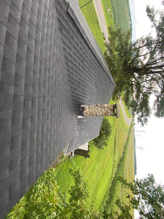 Storm damage roof replacement by Nitro Roofing and Construction