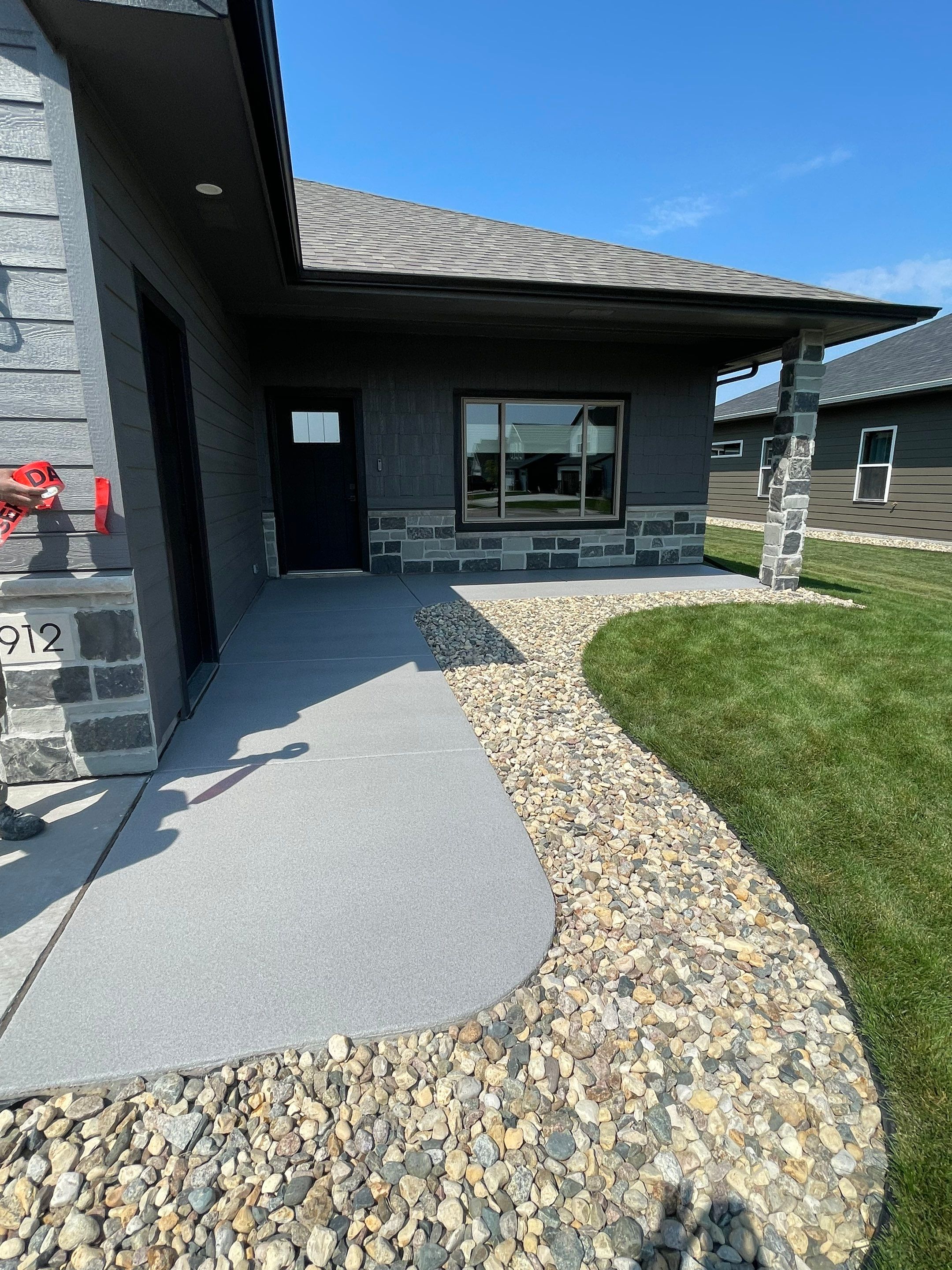 Sioux Falls Residential Concrete Patio and Walkway Coating by Select Painting, Coatings & Garage Cabinets