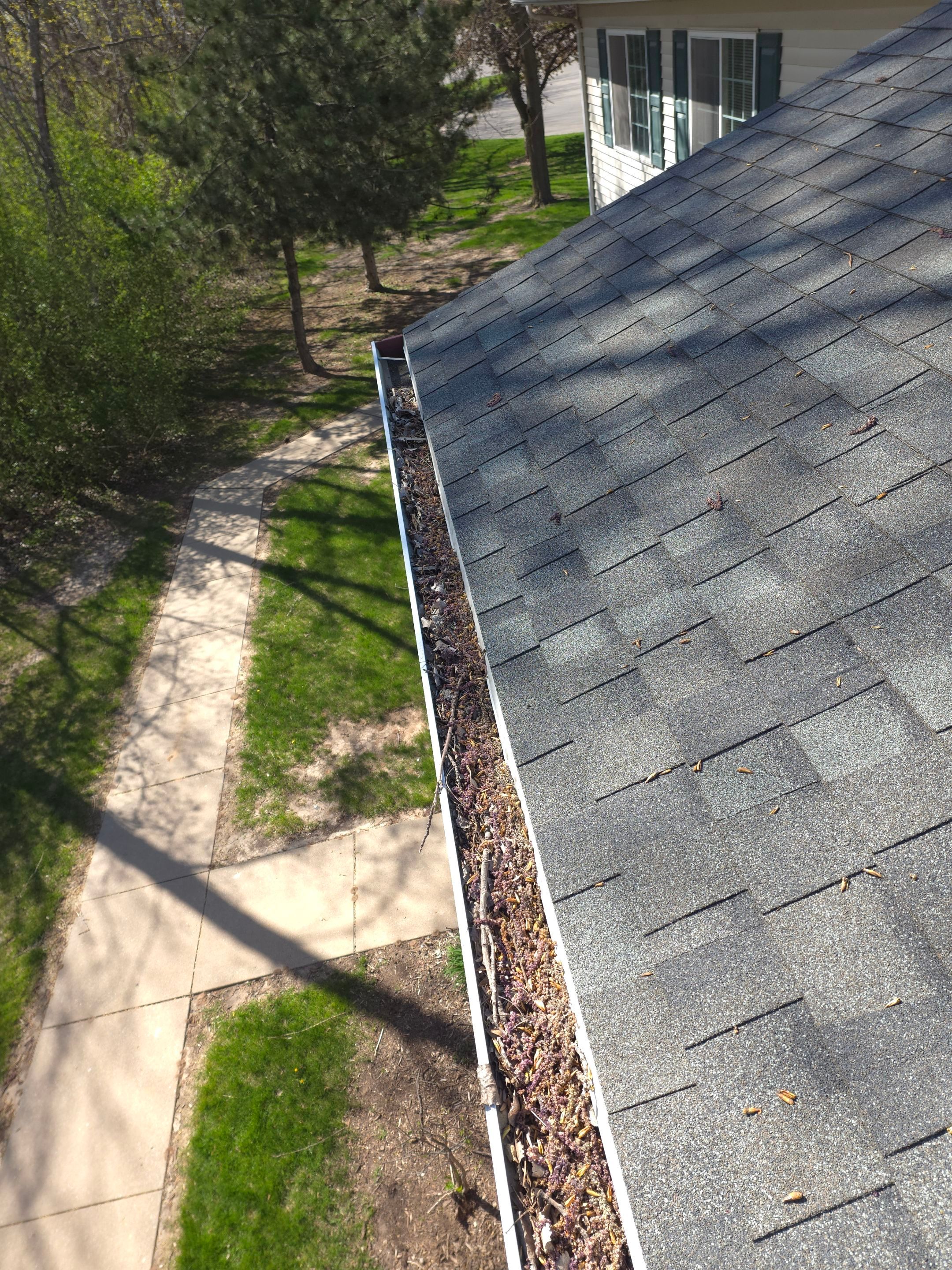 Commercial gutter cleaning Appleton & Oshkosh, WI before photo with filled gutters