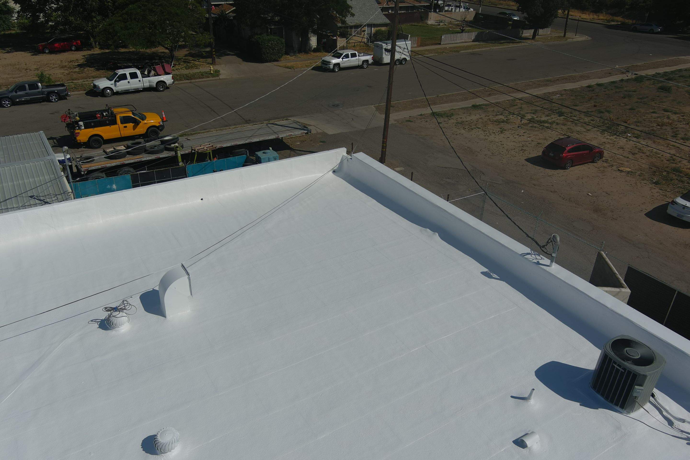 Spray foam and coatings using Conklin Benchmark/PUMA XL coatings and spray foam by Straight Edge Roofing Inc