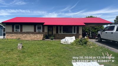 Red ABM Panel Metal Roofing Installation on Elizabethville Ranch Home