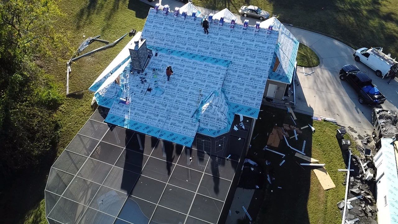 Roof and Gutter System Replacement with Stone Chimney Rebuild by Undersun Roofing 