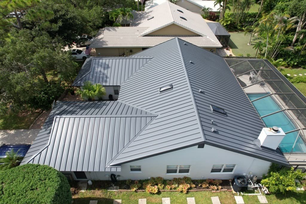 Standing Seam Metal Charcoal Grey Roof Replacement and Skylight Installation in Jupiter by Art's Roofing & Construction