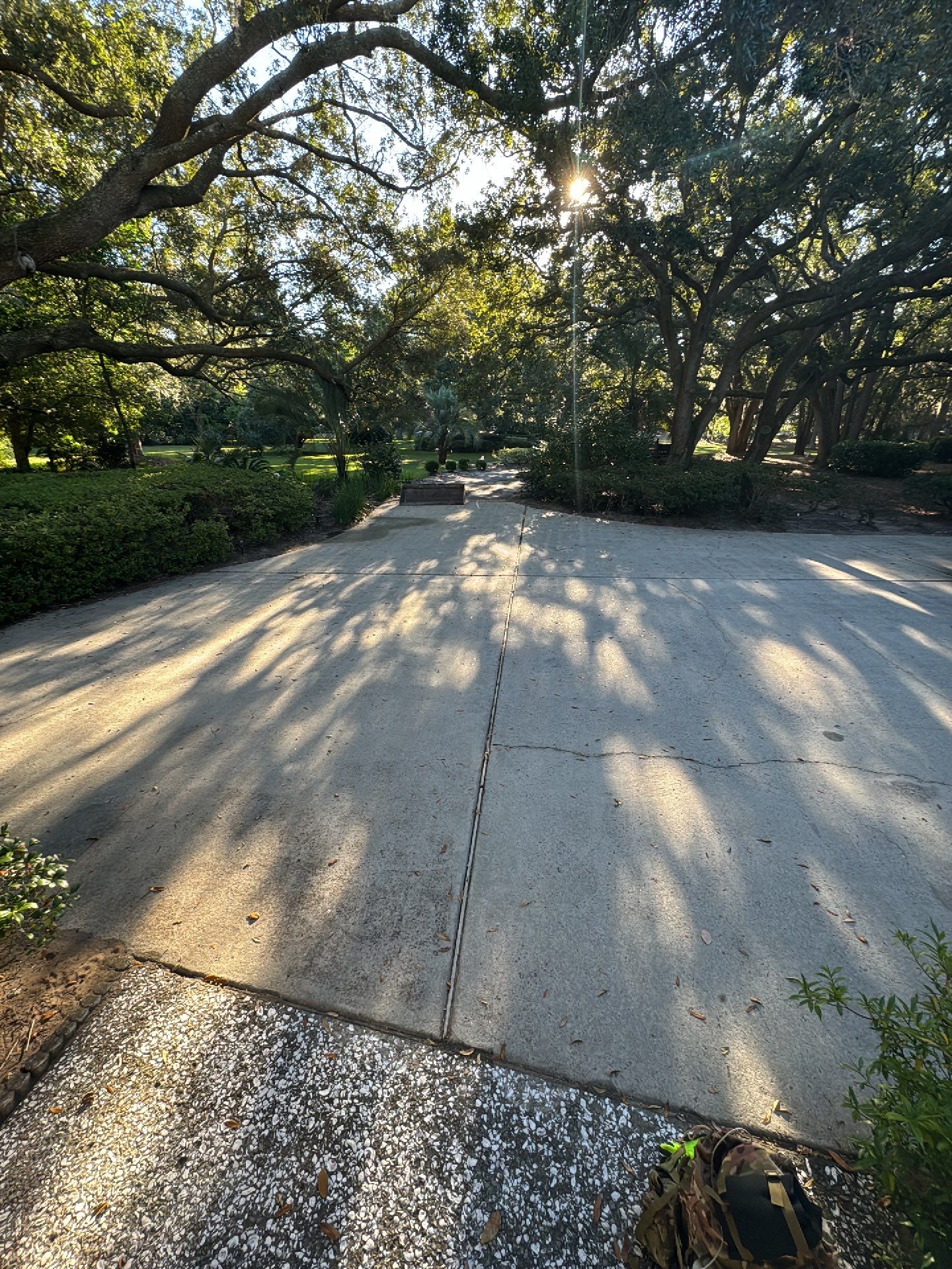 Custom Concrete Driveway with Decorative Paver Inlays in Hilton Head Island by Lowcountry Scapes, LLC