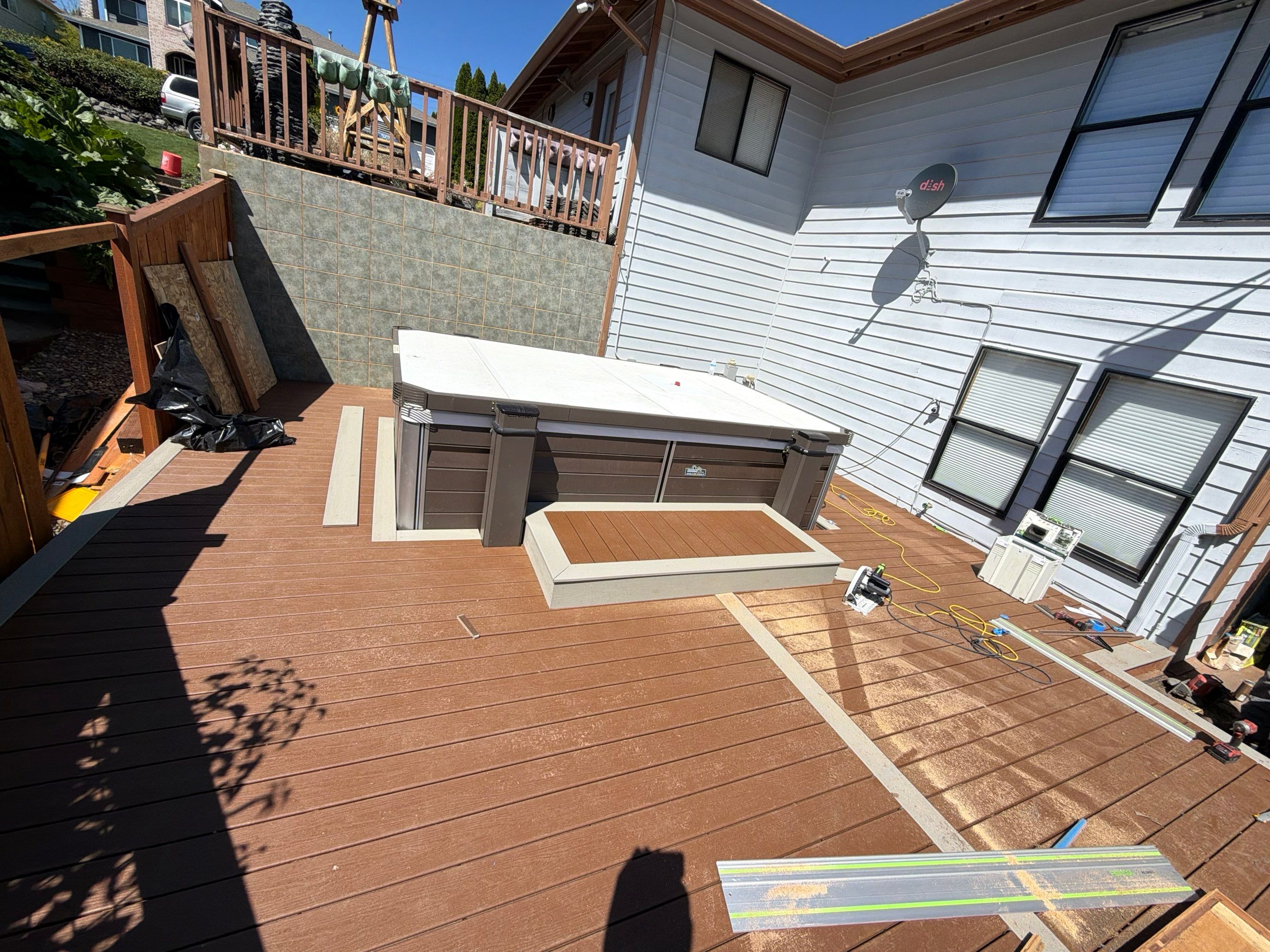 Tacoma Custom Composite Deck and Hot Tub Surround with Retaining Wall by Emerald City Energy 