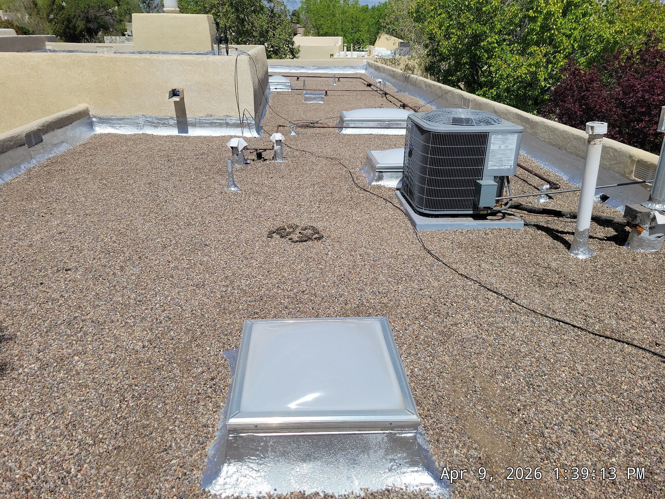 Tar and Gravel Roof Maintenance and Skylight Sealing in Rio Rancho by Doyle Roof Masters Inc
