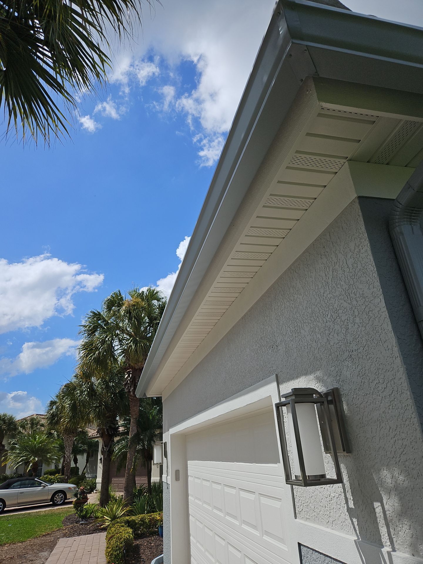 6-inch K-style Seamless Gutters and Splash Guard in Grey Color in Naples FL by Gutter Professors