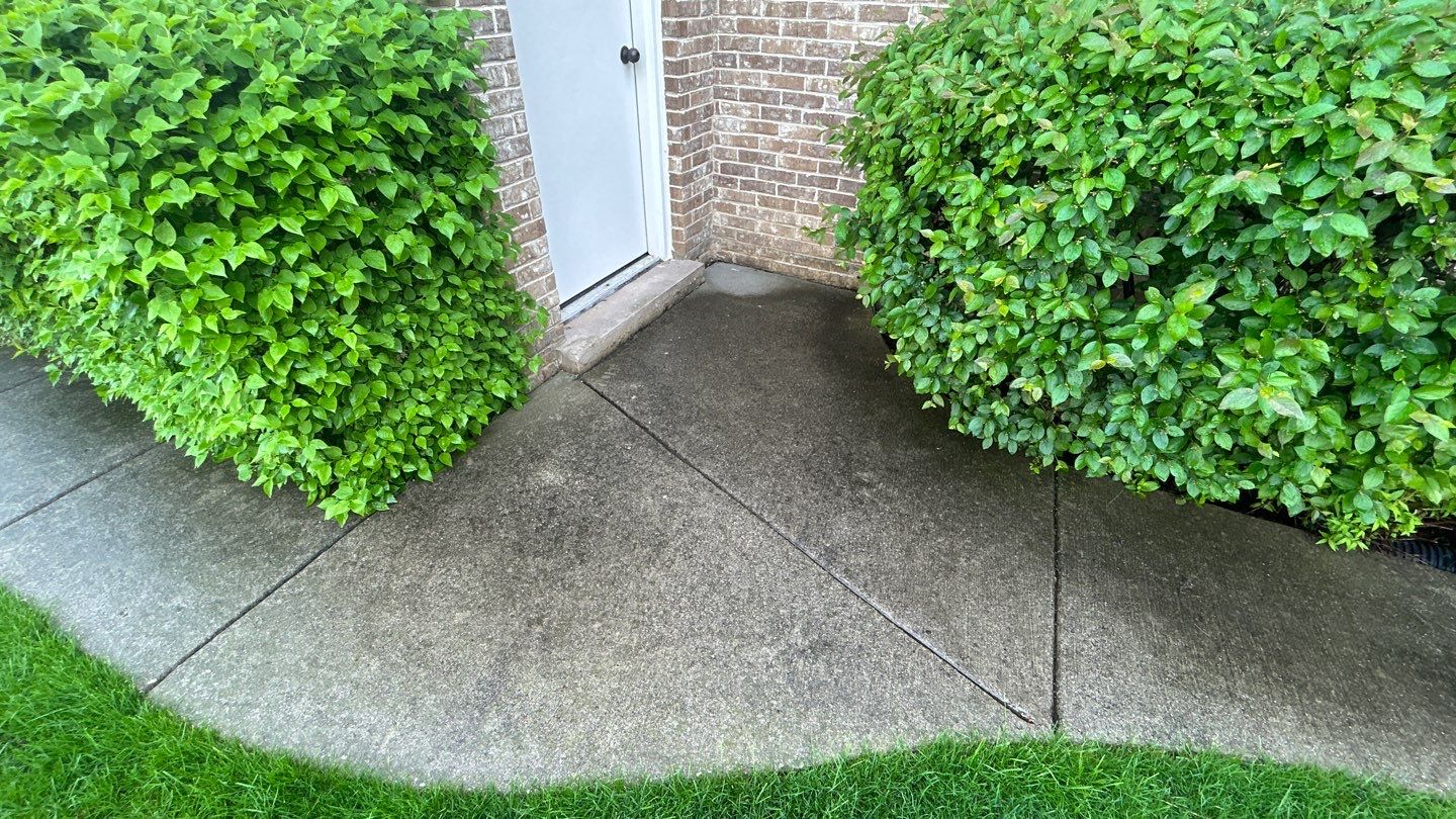 concrete patio and driveway cleaning by Northern Power Washing LLC.