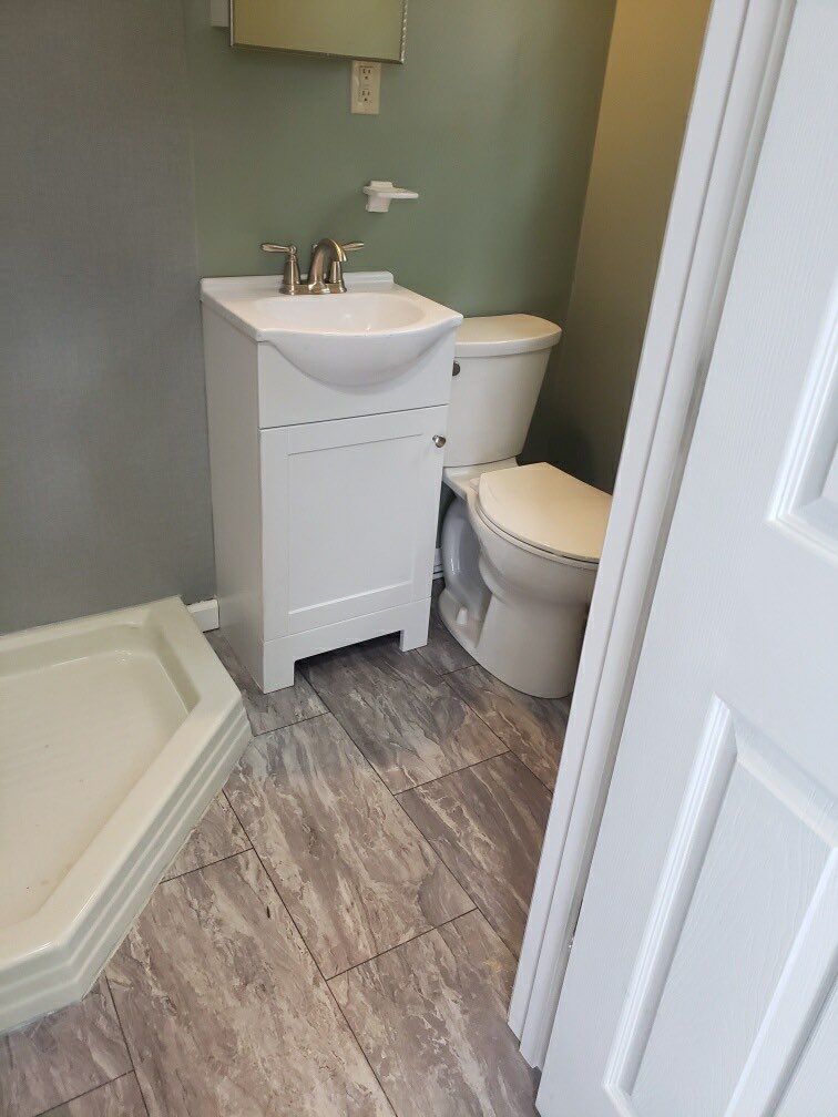 Bathroom Remodel using BCI Acrylic Shower System by Secure Construction Company Inc