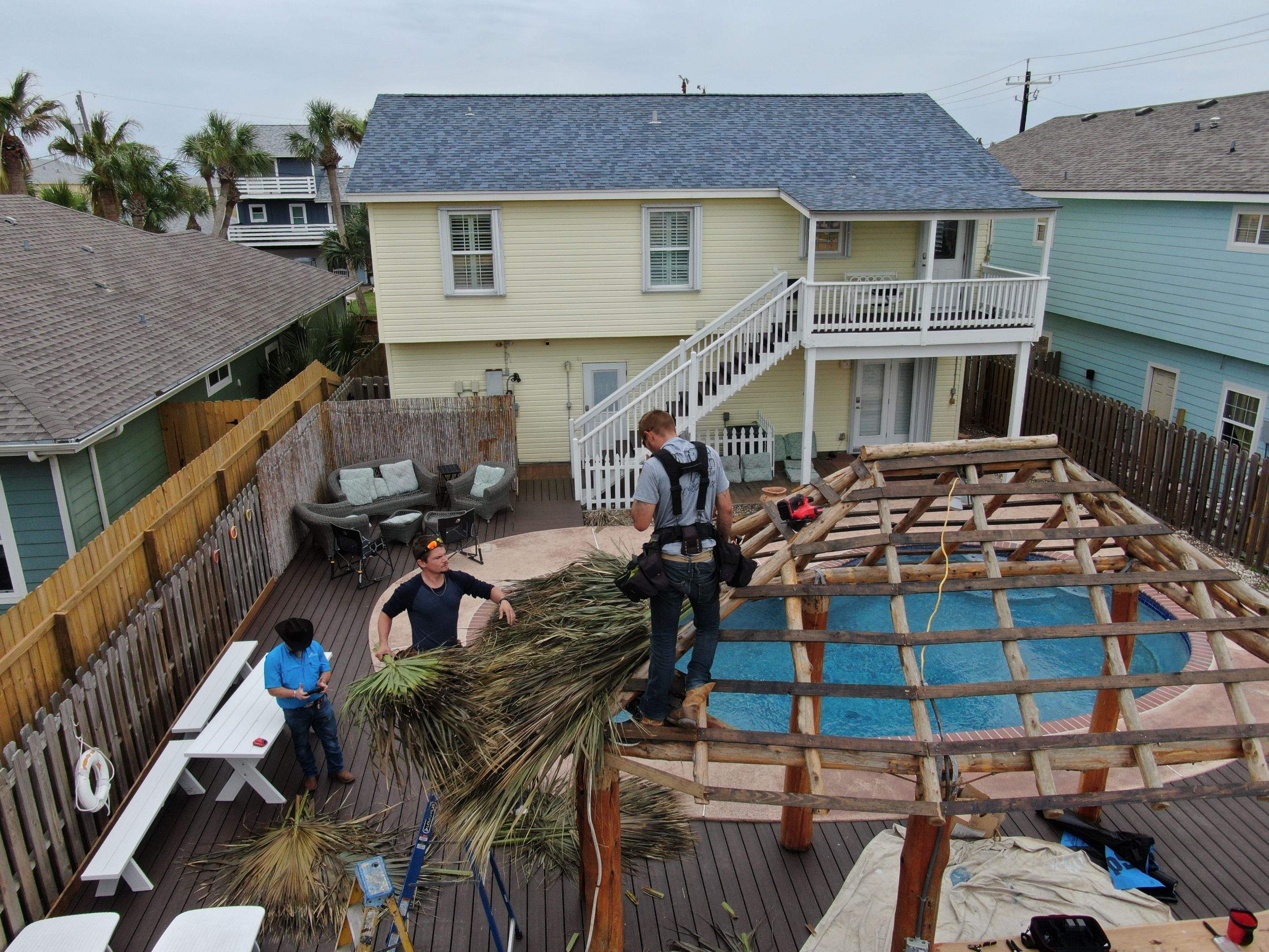 Poolside paradise by Bayfront Roofing and Construction